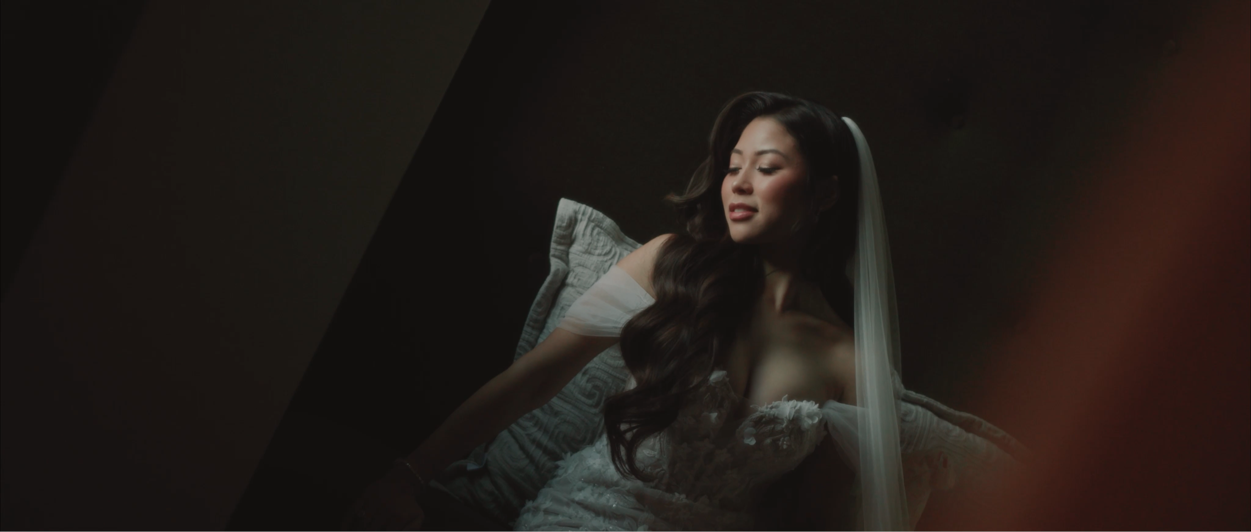 Bride and groom walking down the aisle after wedding ceremony, surrounded by guests clapping.