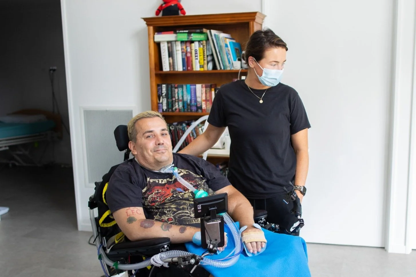 At Home Care worker with Pulse resident in wheelchair 