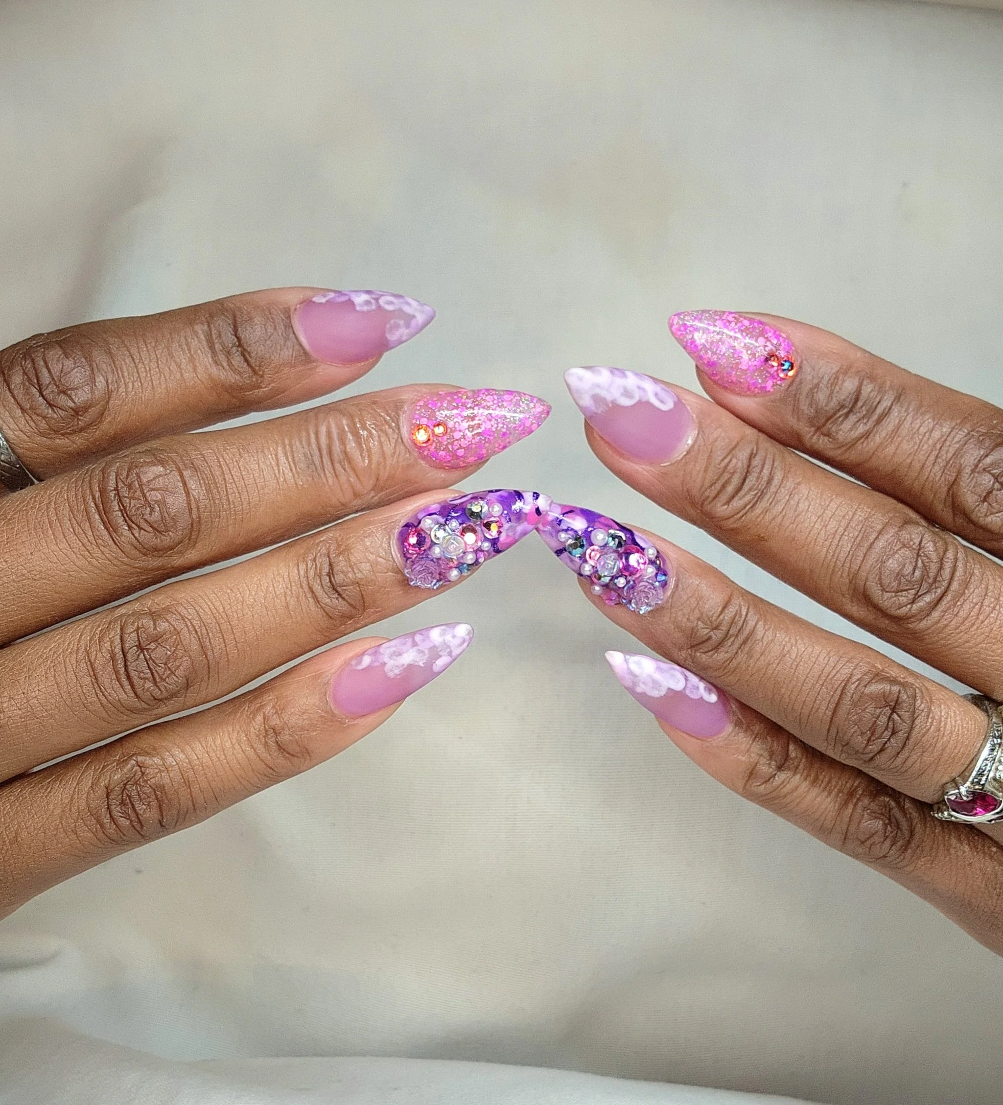 Amazing pink point nails with gems and sparkles