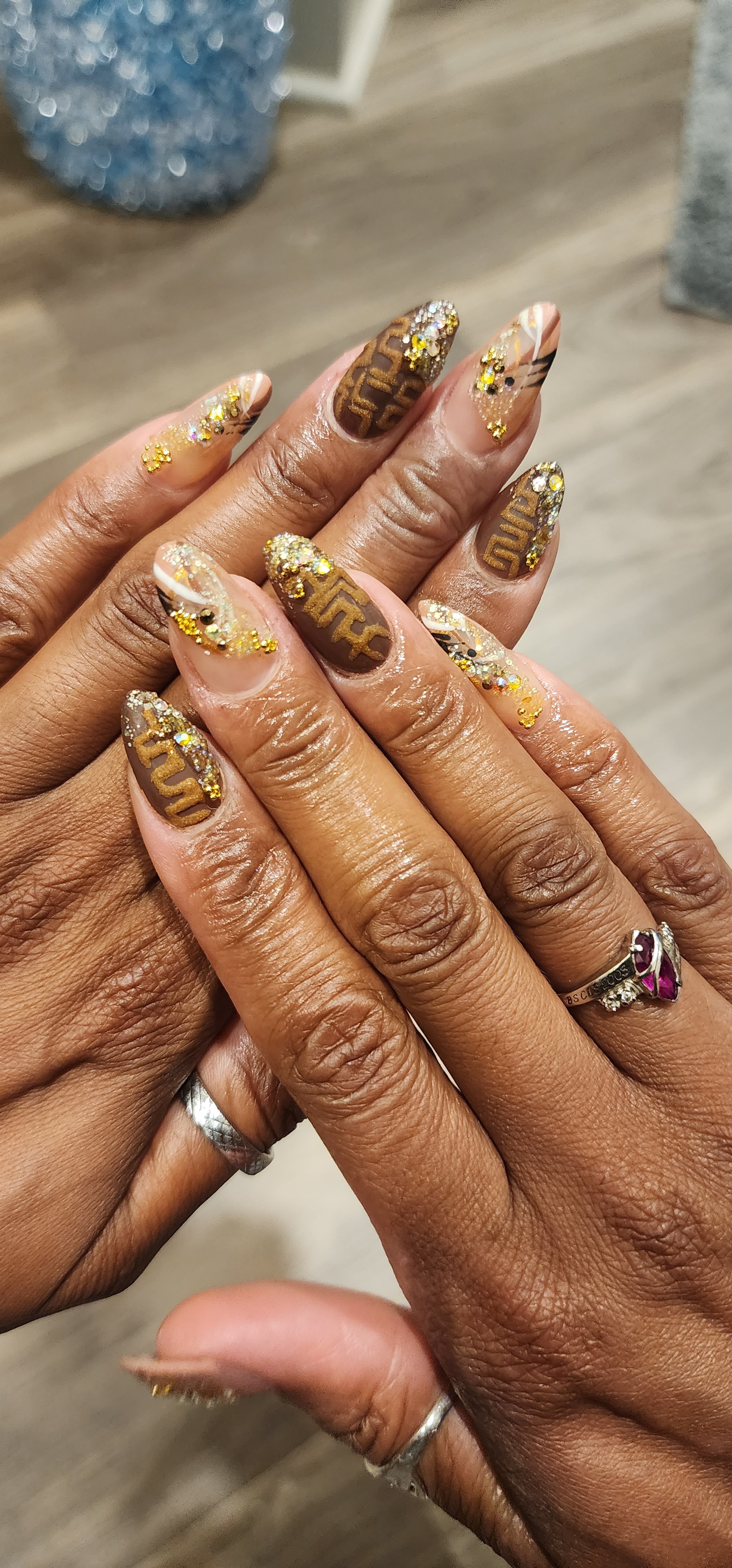 Brown almond nails with nail art