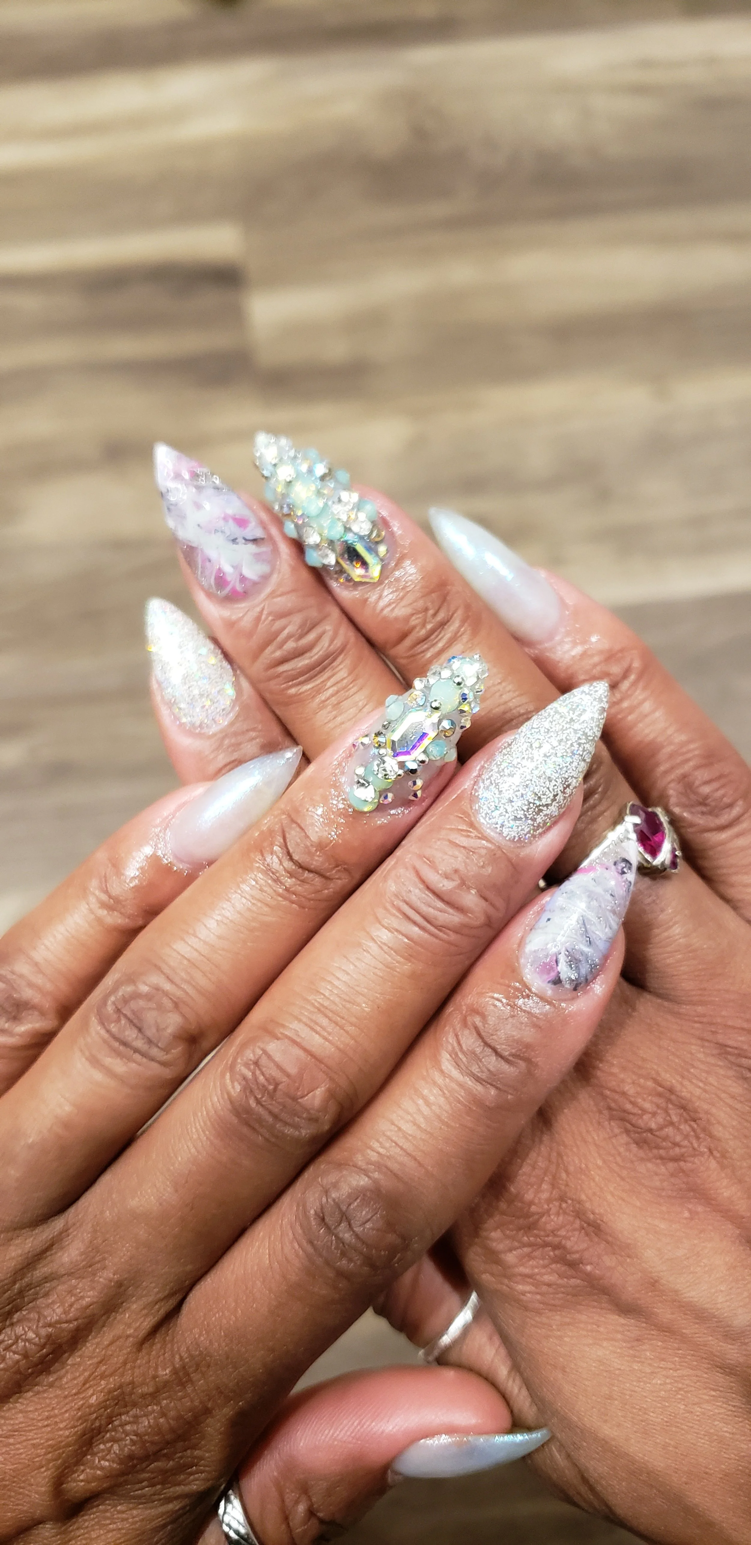 Silver point acrylic nails with genstones and nail art