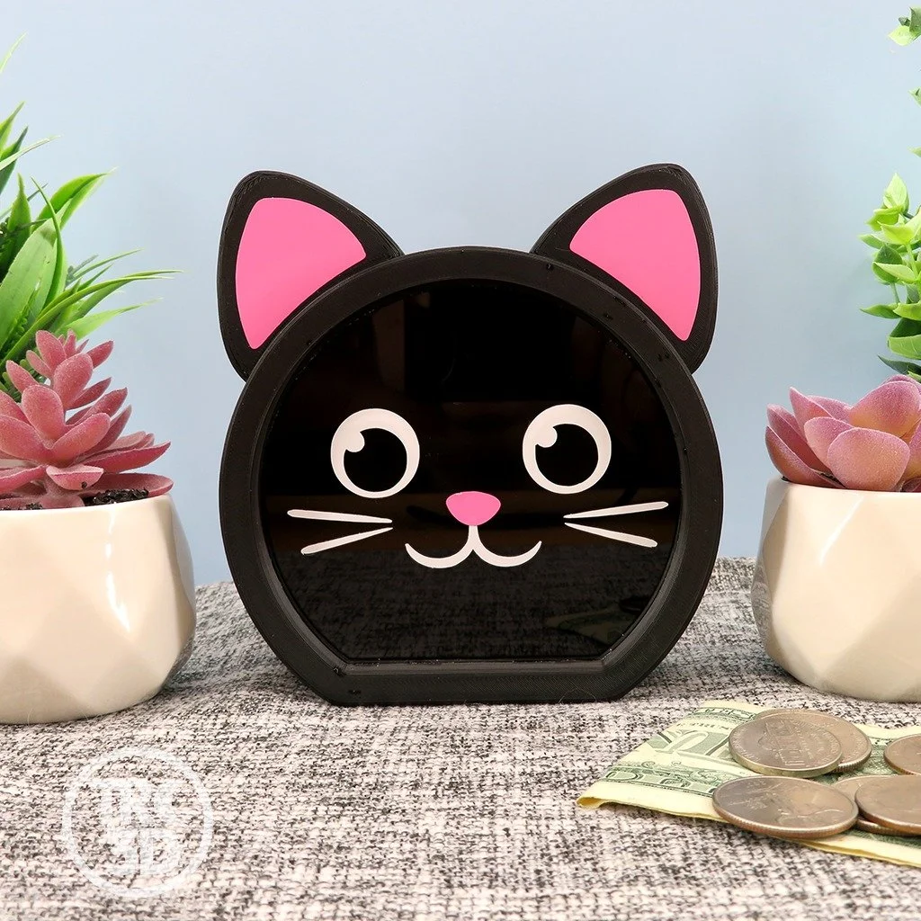 🐾✨ Exciting news! Meet the newest member of my Kitty Coin Banks family: an adorable black cat! 🖤🐱 But this cutie needs a name! What do you think I should call it? 😻

Head over to my store (link in bio) to welcome this little feline friend into yo