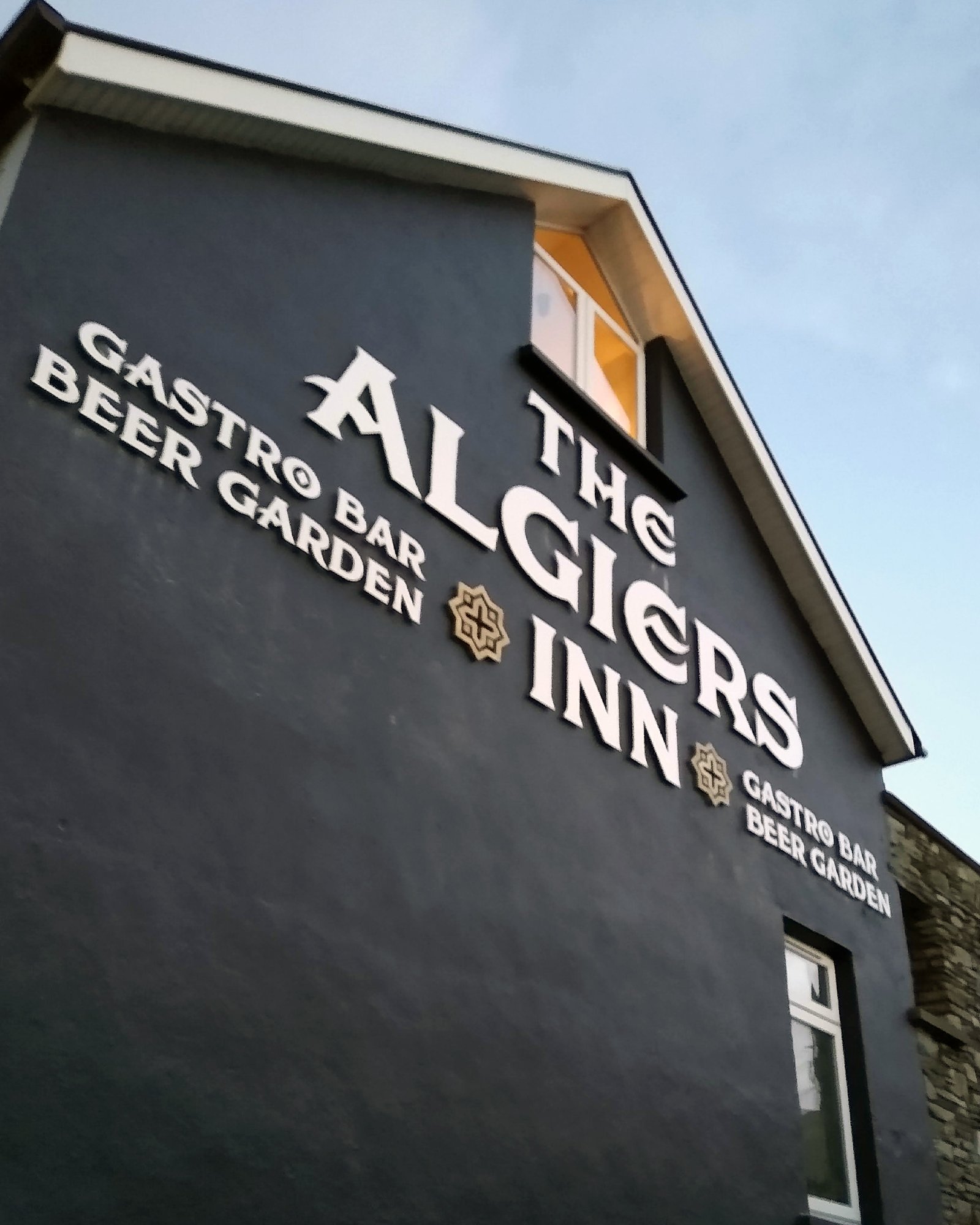 Contracted by a design firm, Barrow Signs Limited supplied and installed signage for the new proprietors of the Algiers Inn, Baltimore, Co. Cork. Signage on this gable end is made from 19mm CNC cut Foamex and painted white and gold. The "A" is over