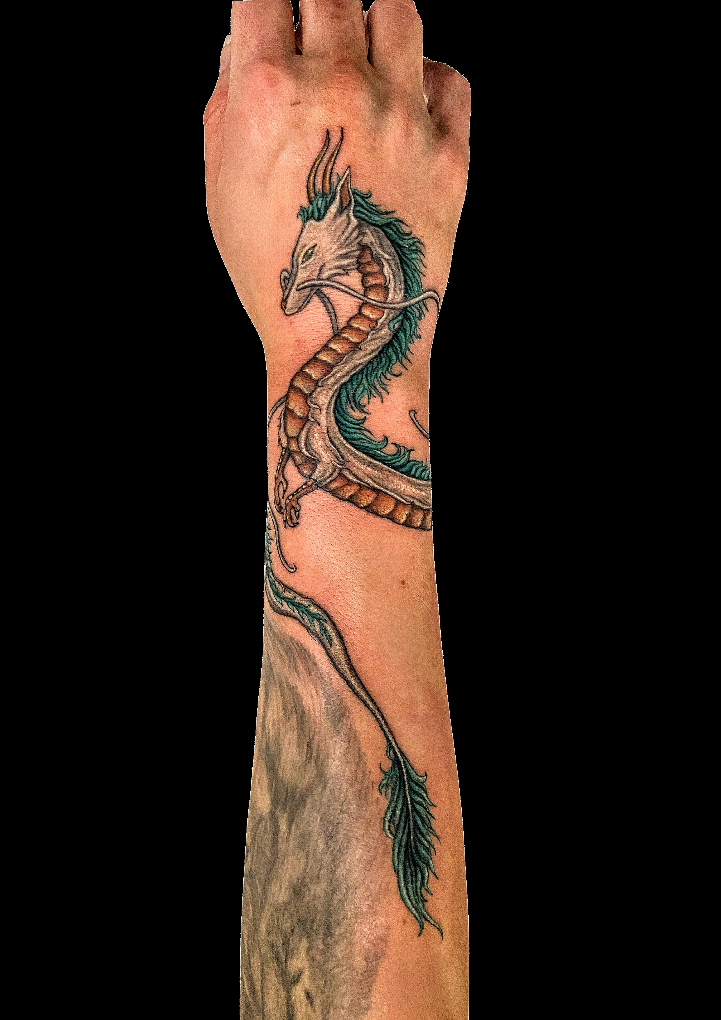 Long dragon tattoo following the curve of the arm.