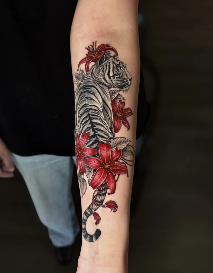Chris Kennedy’s tiger tattoo with red lilies