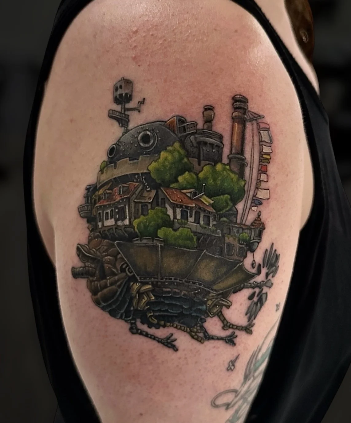 Colour Howl’s Moving Castle tattoo on the shoulder, by Chris Kennedy.