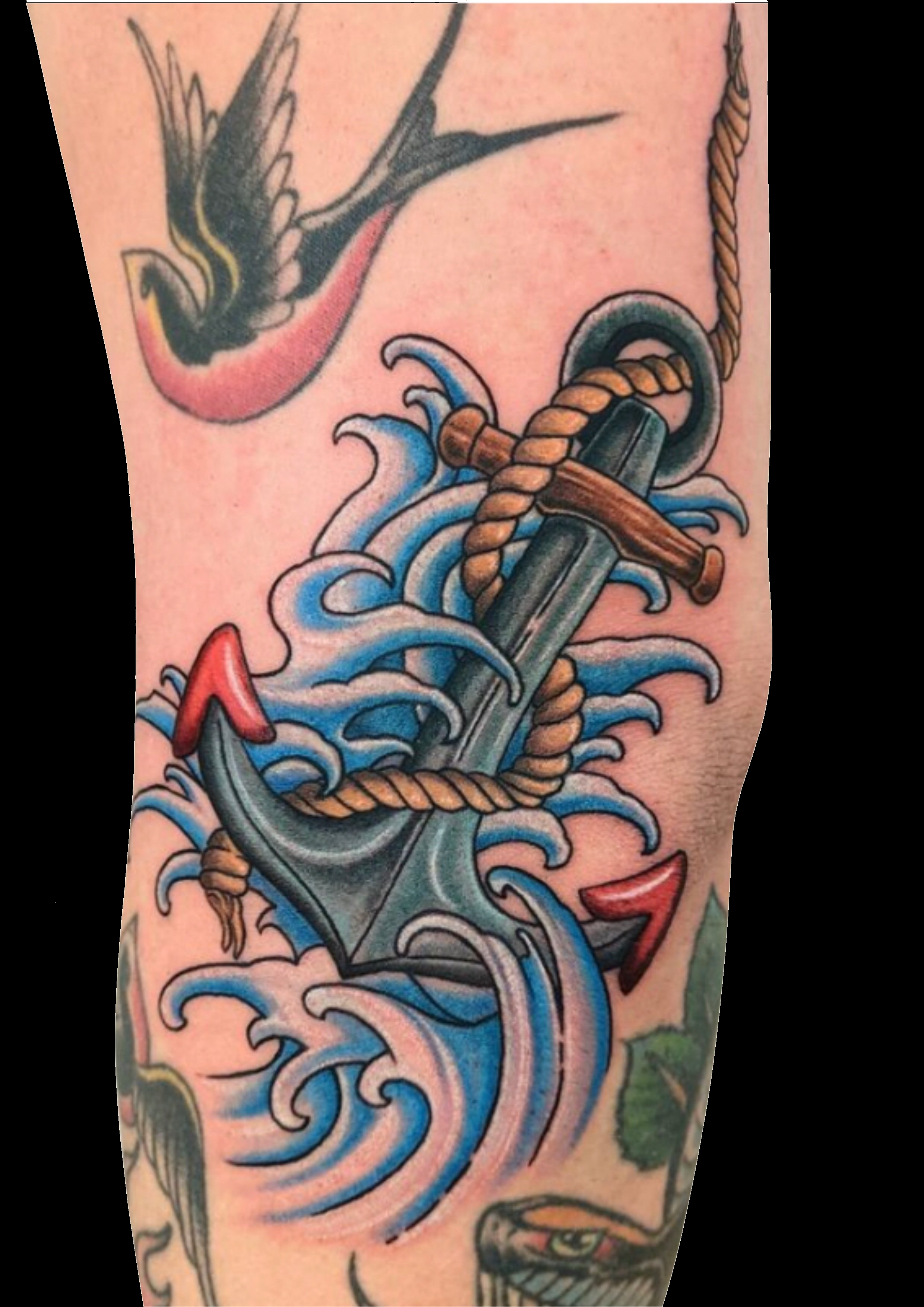 Blue and orange octopus tattoo with curling tentacles.