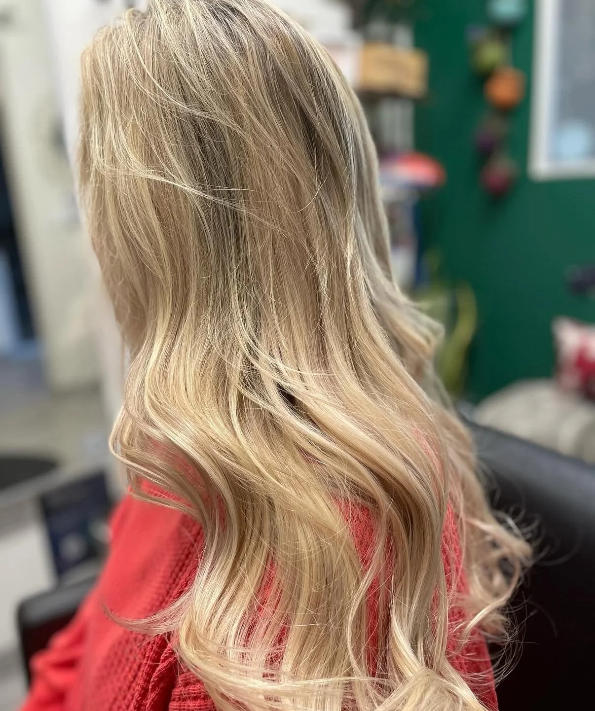 Blonde color and length-enhancing extensions with a soft, healthy finish at Zen Den Salon Encinitas.