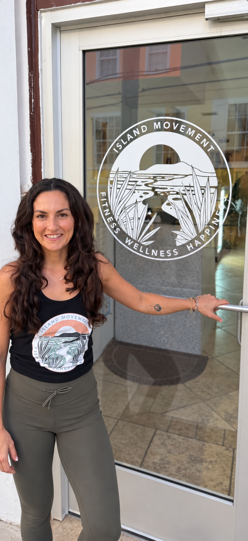 Mariesa Barbara, DPT, owner of Island Movement, at the entrance to her yoga, Pilates, and strength studio in Christiansted, St. Croix