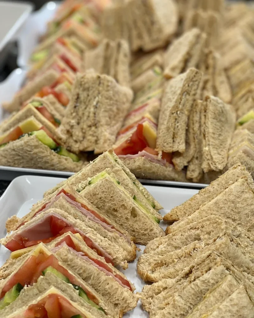 Assorted tea sandwiches on a tray, including cucumber, tomato, ham, and cheese. Health and Nutrition meal for children who attend Brightside Early Learning Centre in Paralowie