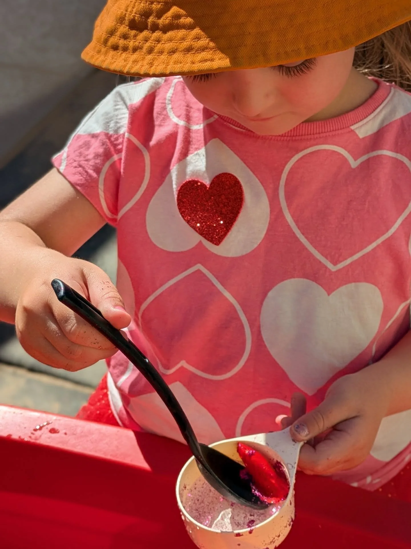 A child who attends Brightside early learning centre that is engaging in a sensory play activitiy