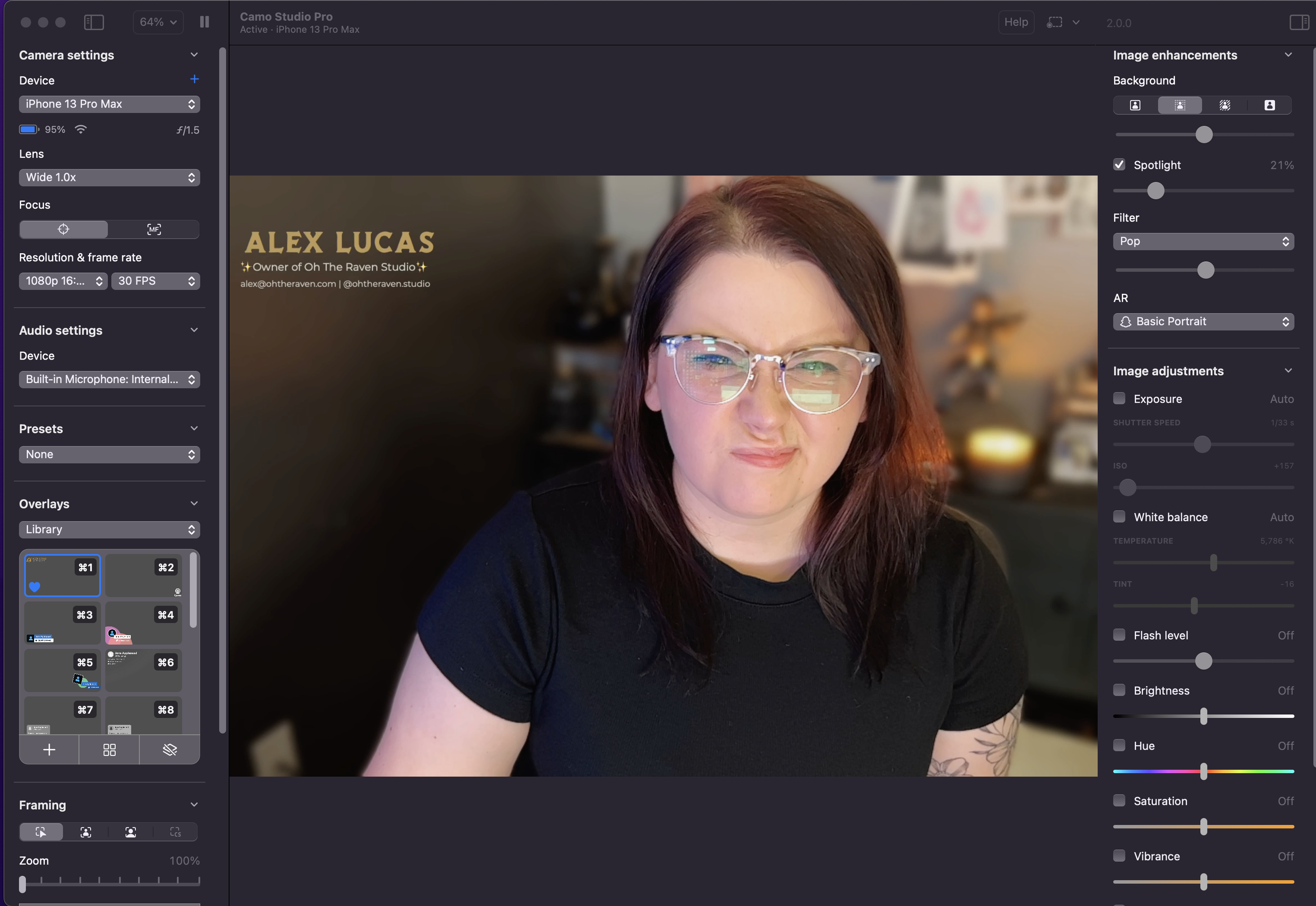 Alex Lucas, founder and owner of Oh The Raven Studio. She's a woman with shoulder-length dark hair, wearing glasses and a black shirt, posing for a portrait photo inside a room.