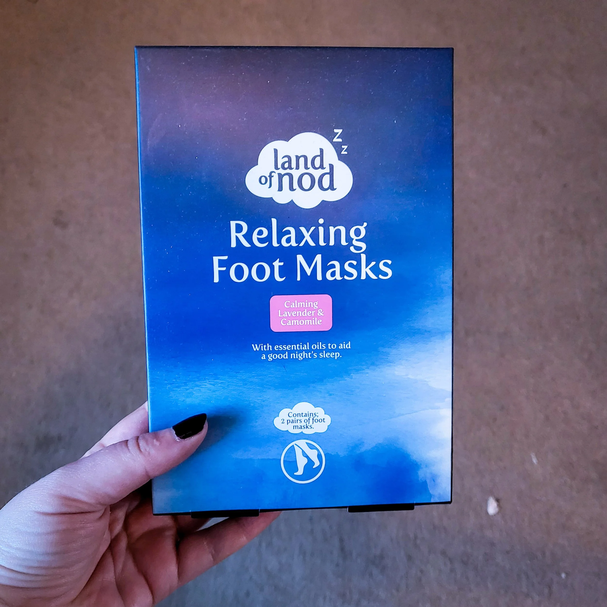 A box with the words "Land of nod: relaxing foot masks"