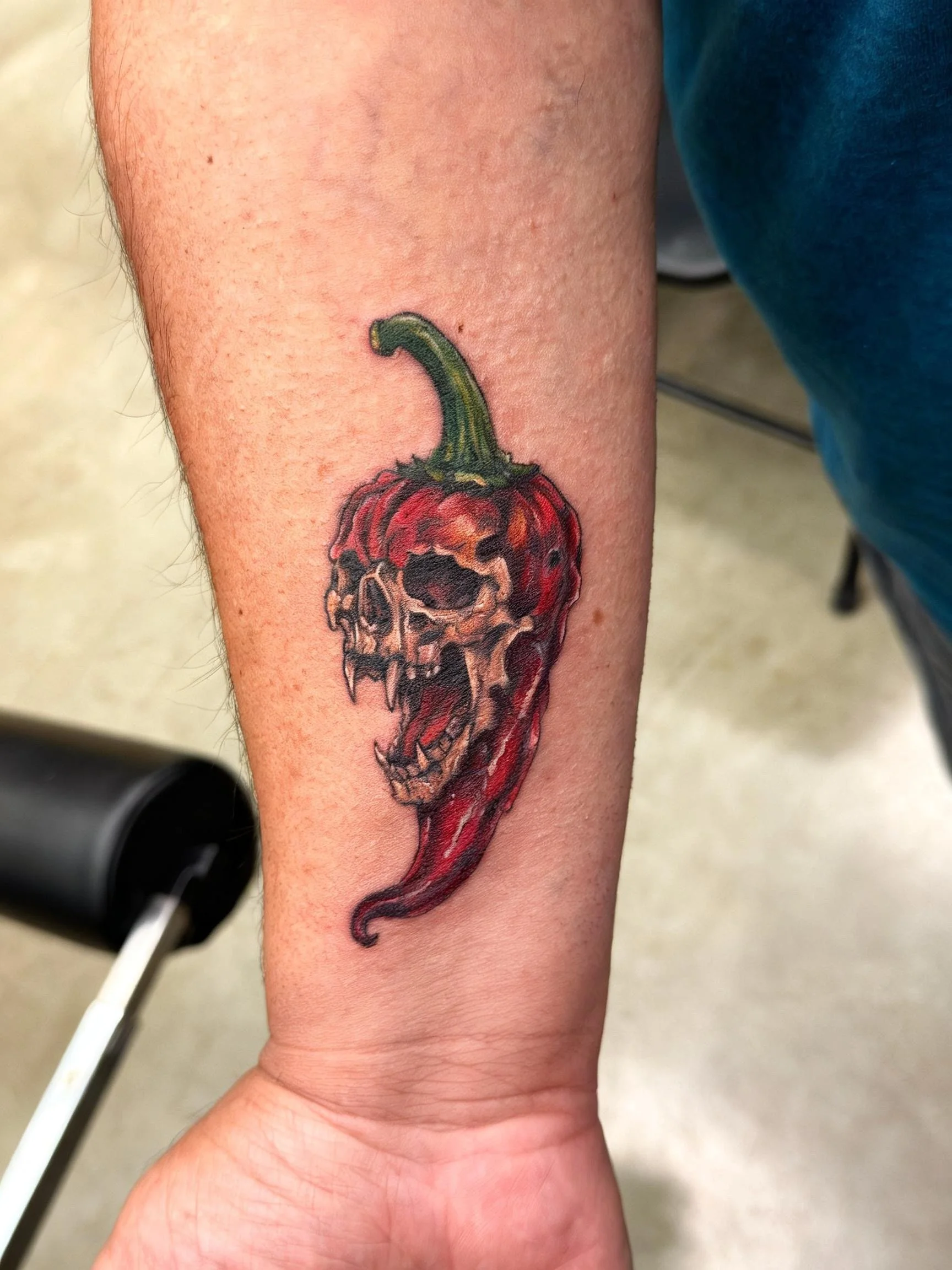 Skull and red pepper tattoo by Dark Mark Ink Tattoo Studio