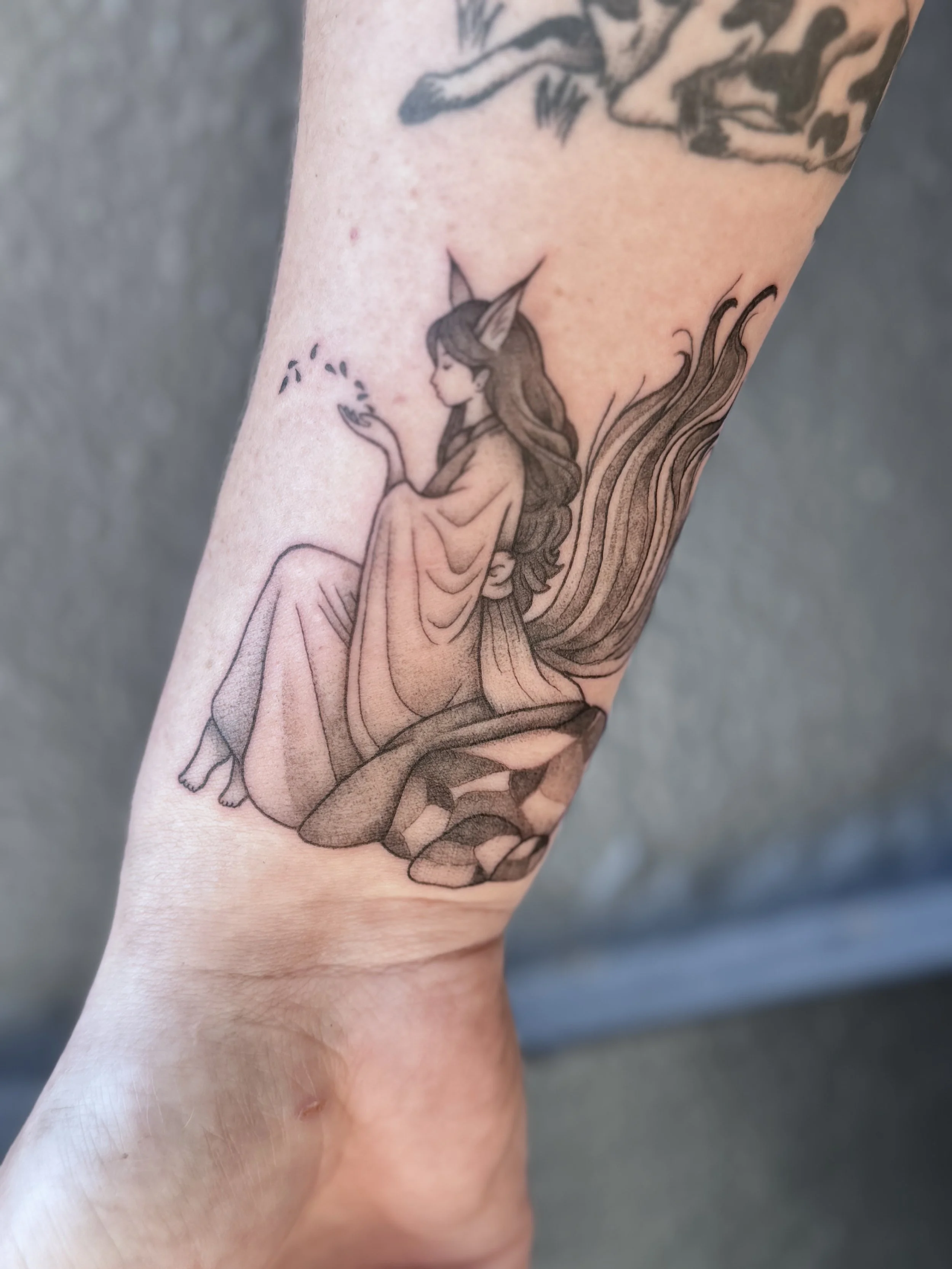Fine line fox tattoo on the forearm by Dark Mark Ink Tattoo Studio