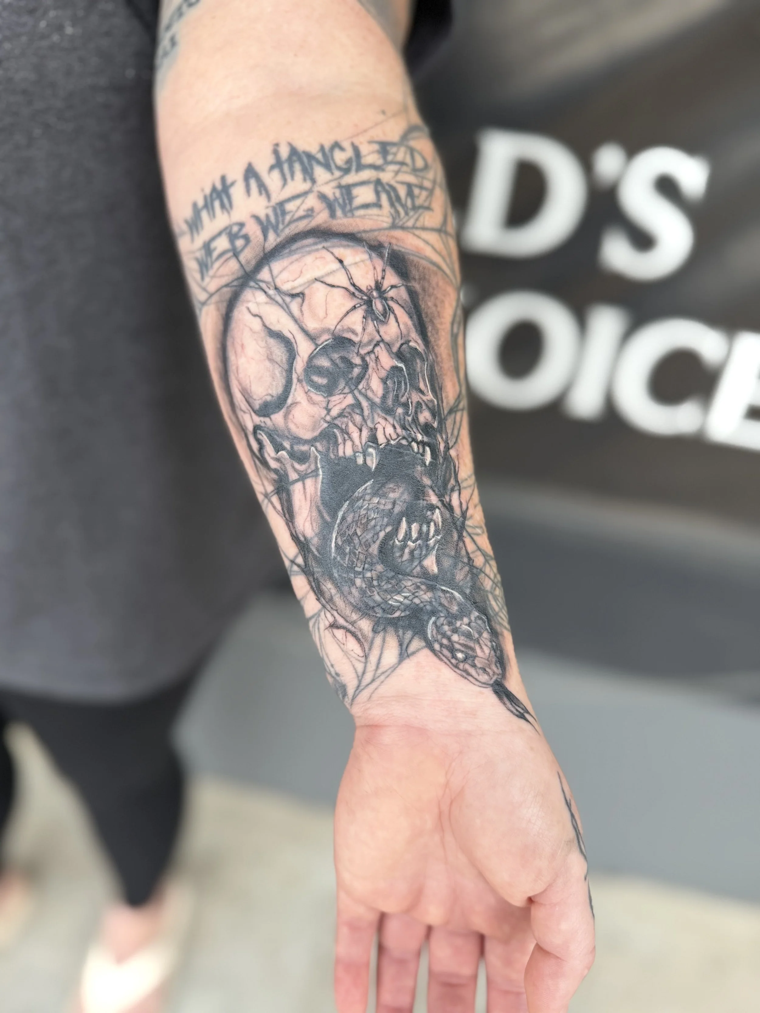 Blast over tattoo done of skull with spider done by GG at Dark Mark Ink