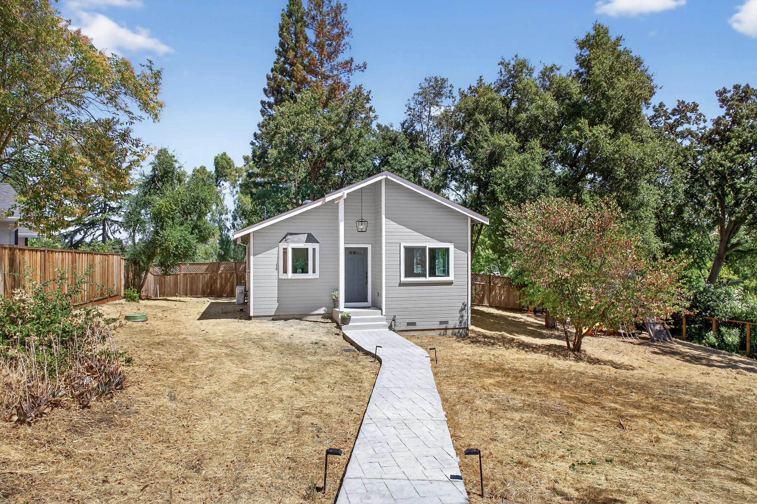 The ADU pathway is lit at night, but we still need to invest in our back yard landscaping. Luckily this may be a partial tax write off for the business