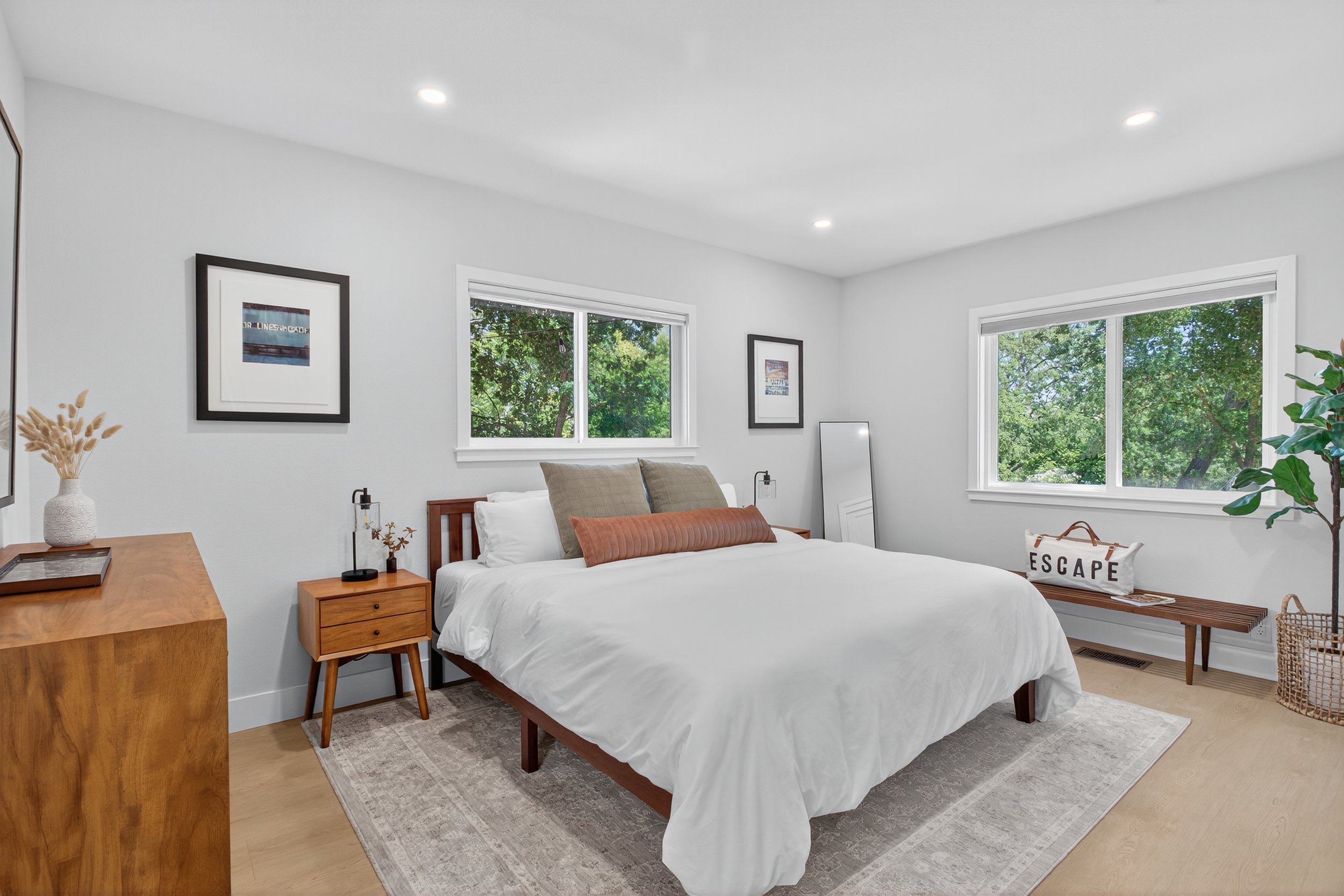 Here is the ADU's bedroom. There are glimpses of Mt Diablo from that big window. Each window has blackout blinds, which are esssential for mid term rentals (many are nurses who work night shifts).