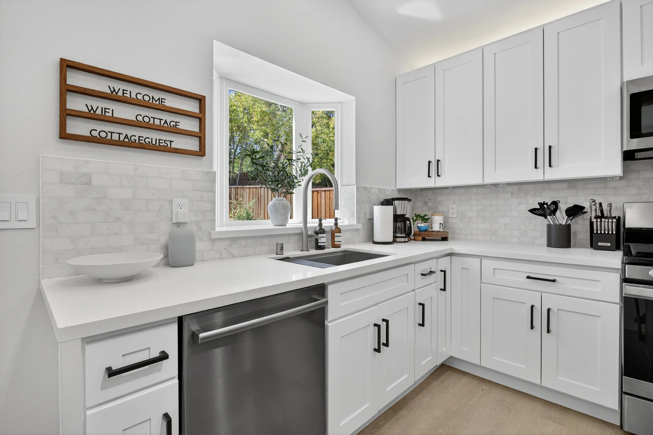 The kitchen's bay window lets in a lot of light.