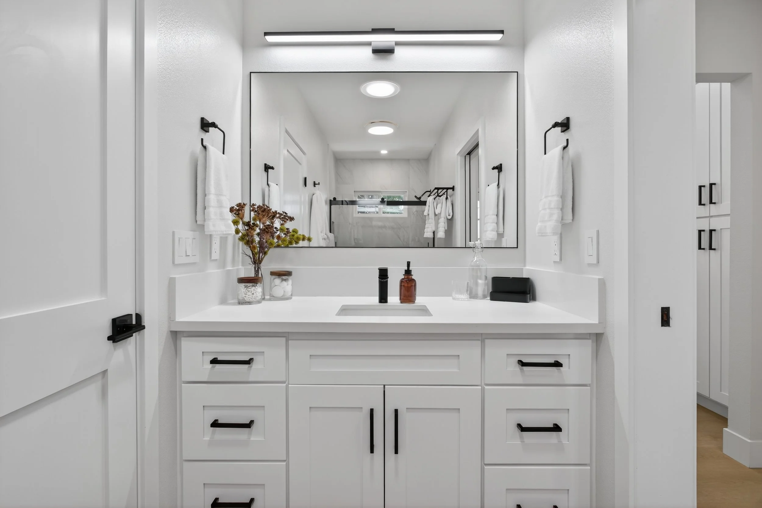 No shortage of lighting in the bathroom...but I still wish we got a backlit mirror.