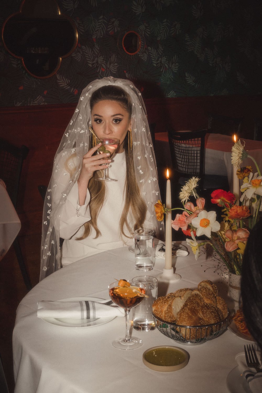 Bride sipping on a martini in Goodfellas Inspired Wedding Editorial