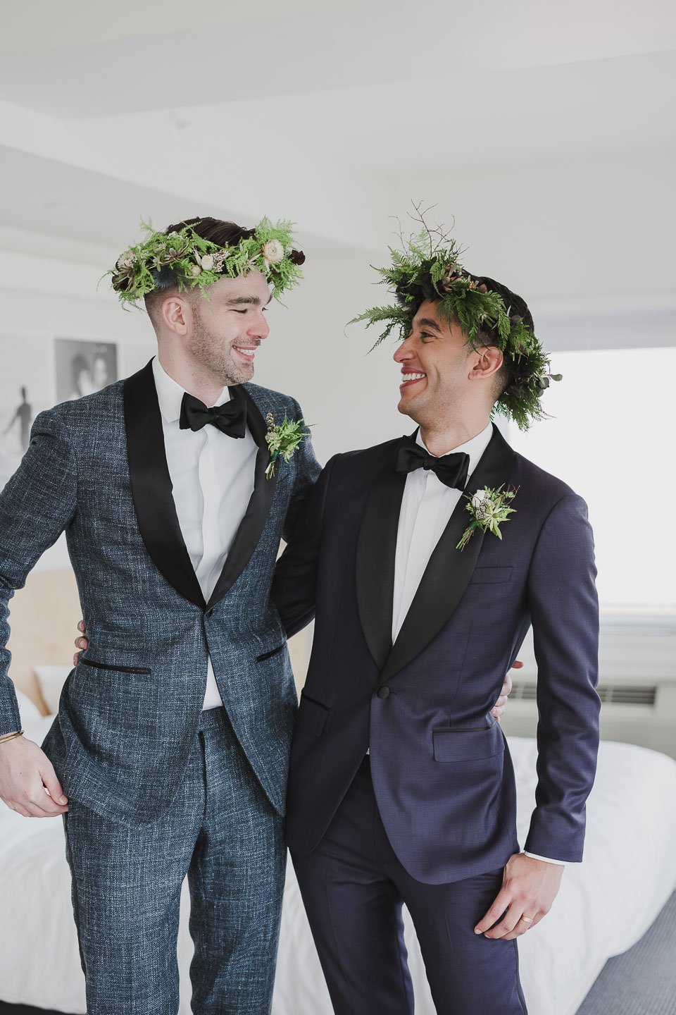 Two grooms in flower crowns