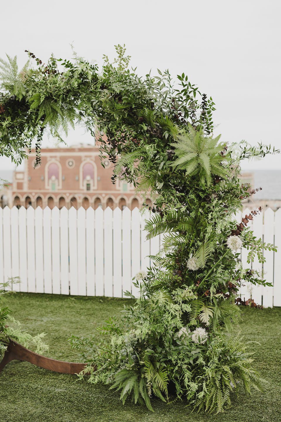 Lush greenery wedding ceremony arch
