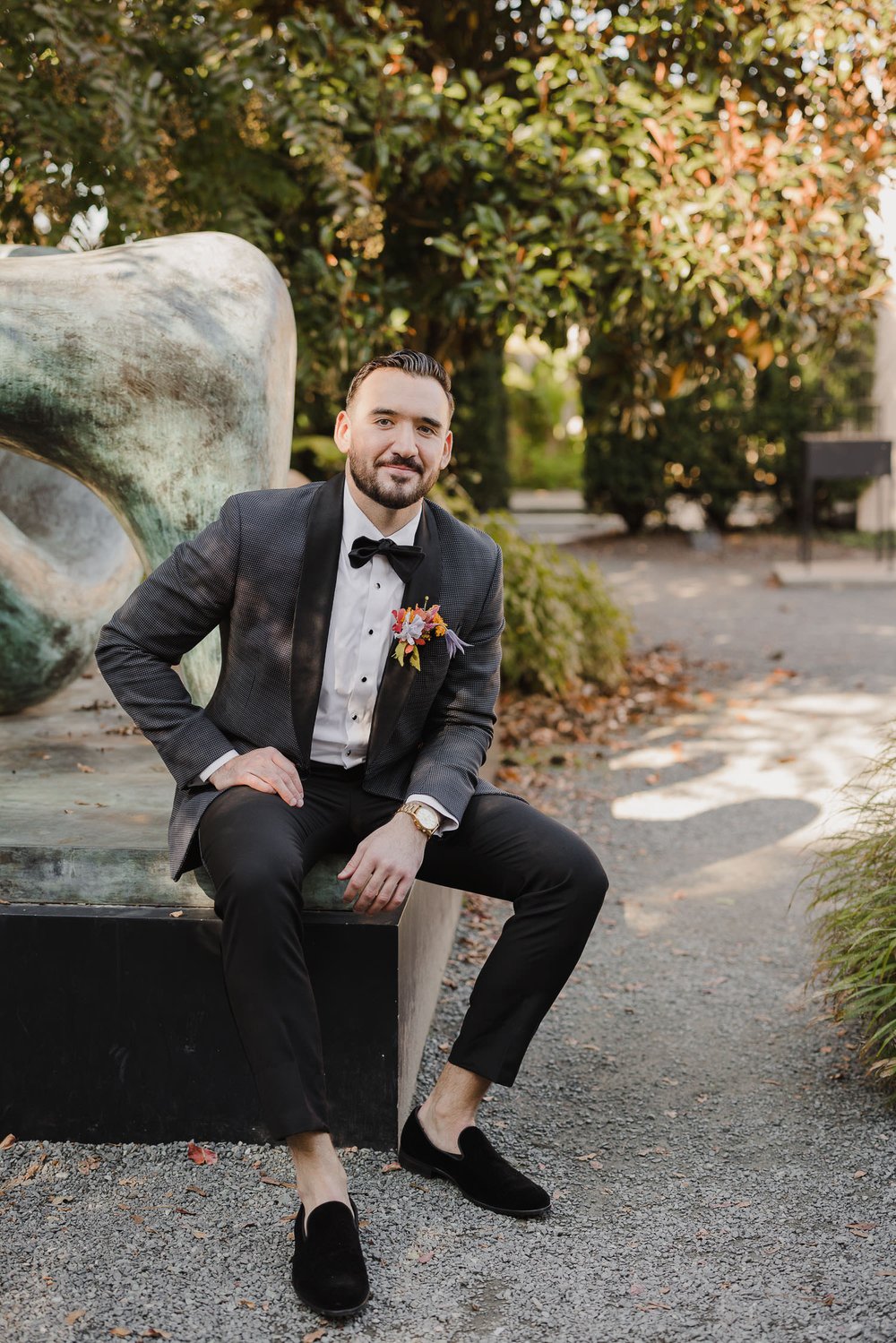 Groom wearing Midnight Pin Dot Tuxedo by The Black Tux