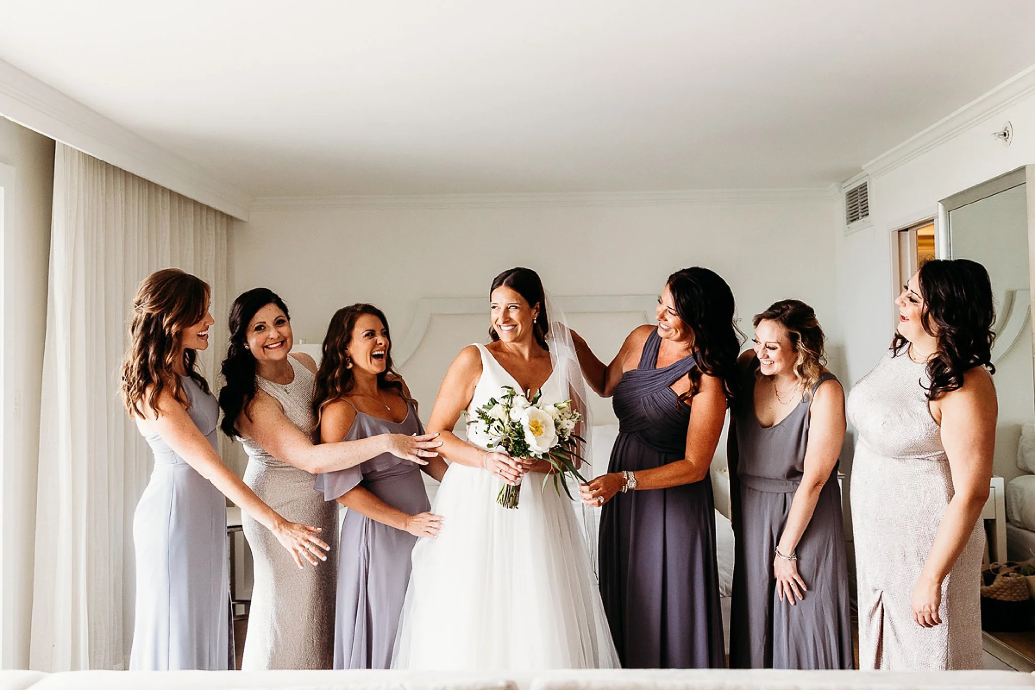 bride with bridesmaids during getting ready