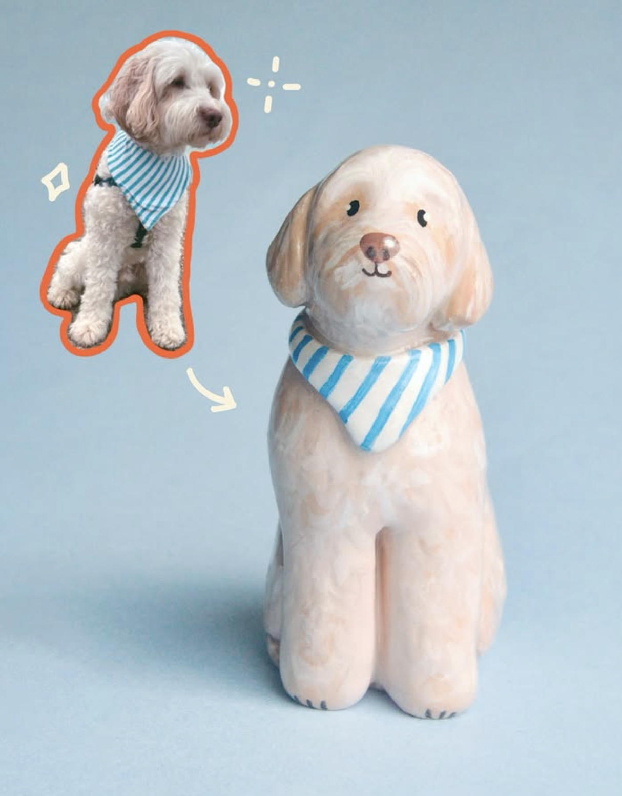 Person drawing a detailed portrait of a dog on a blue paper using colored pencils, with a reference photo of the dog on a smartphone in their left hand.