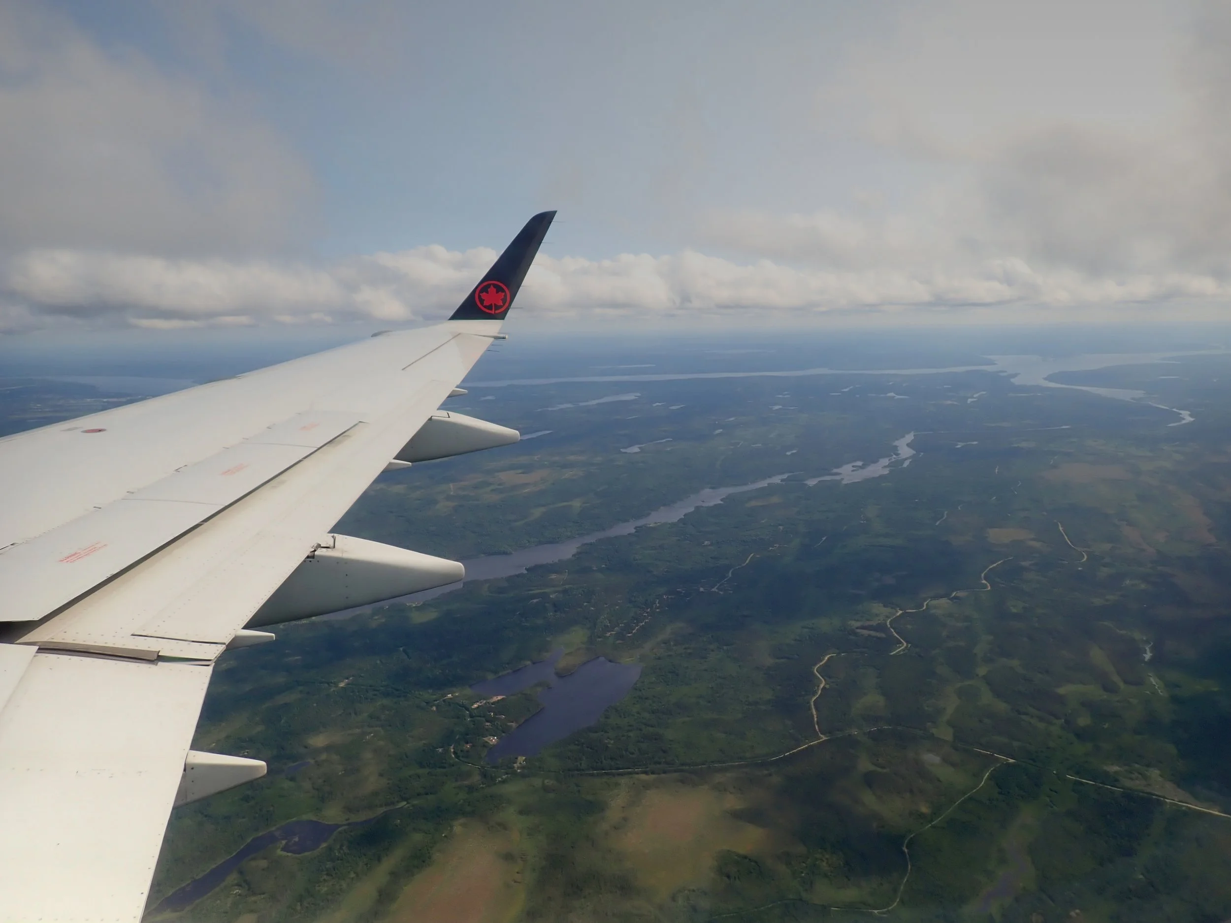 A day late on final approach to Gander International Airport with Gander Lake in background