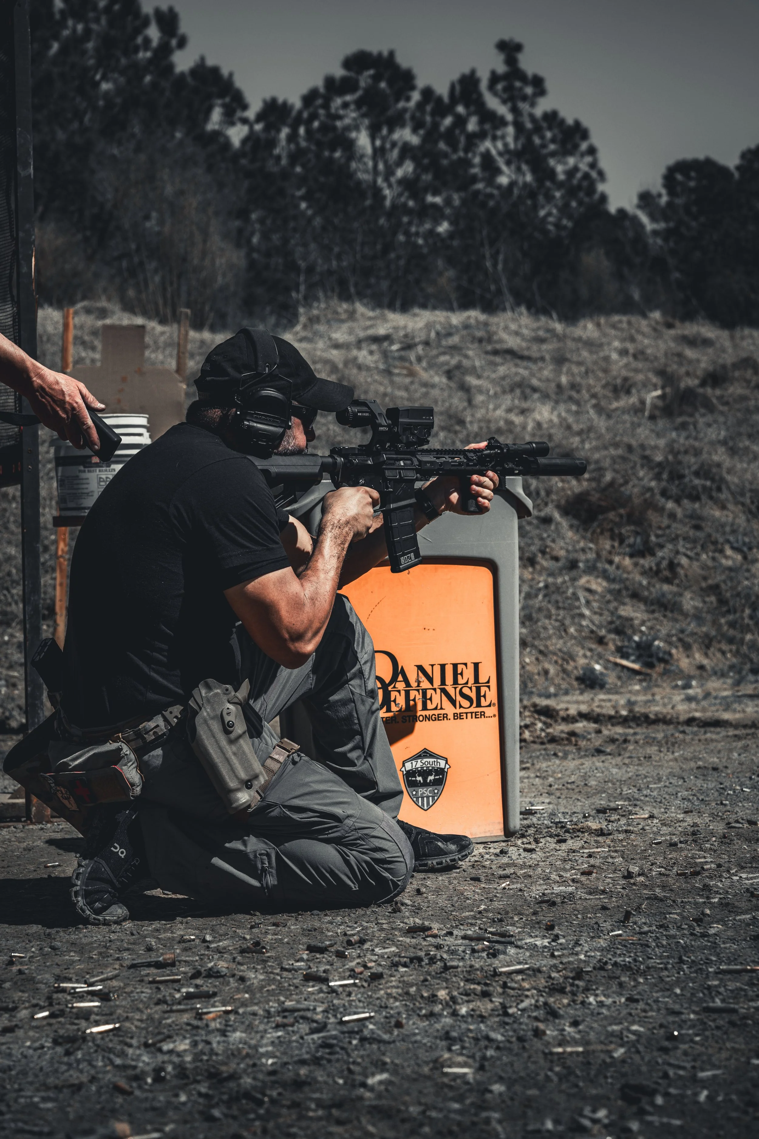 "Michael Bordon, founder of After Action, photographing at a range in Savannah, Georgia"
