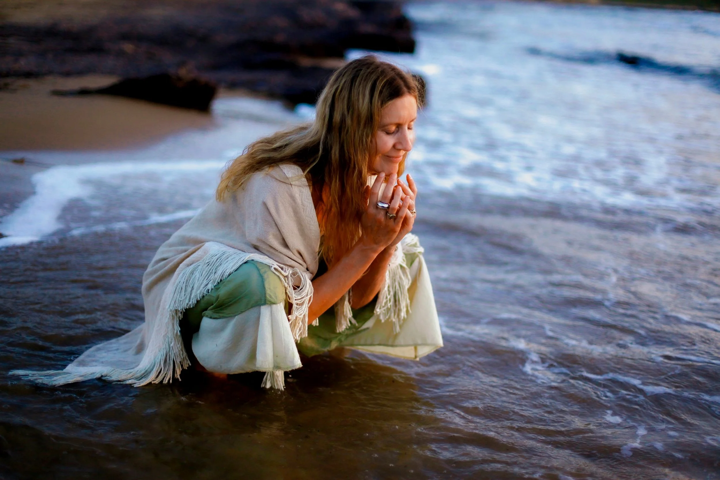 spiritual woman shamanic practitioner in the ocean