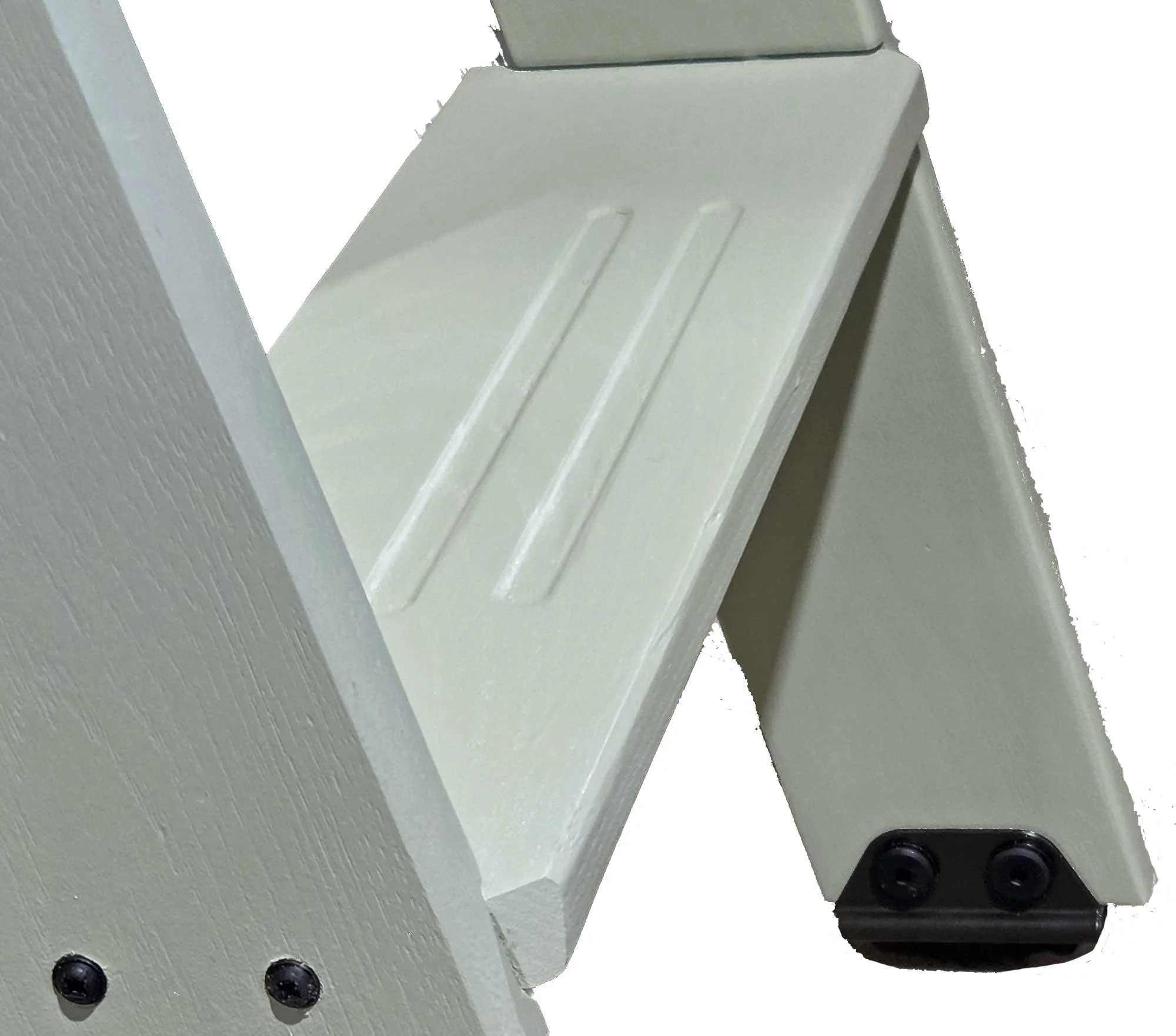 Close-up of a corner of a light green library ladder step showing an angled corner for safety