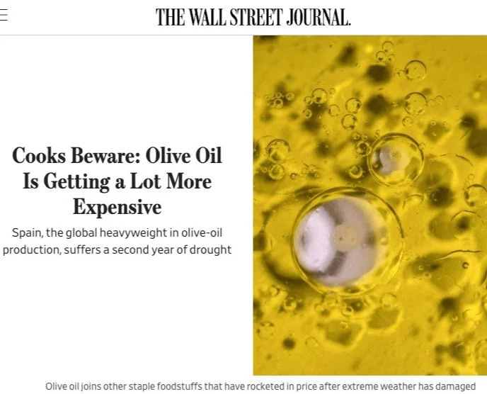 A news headline from The Wall Street Journal about rising olive oil prices due to drought in Spain, with an image of olive oil and bubbles.