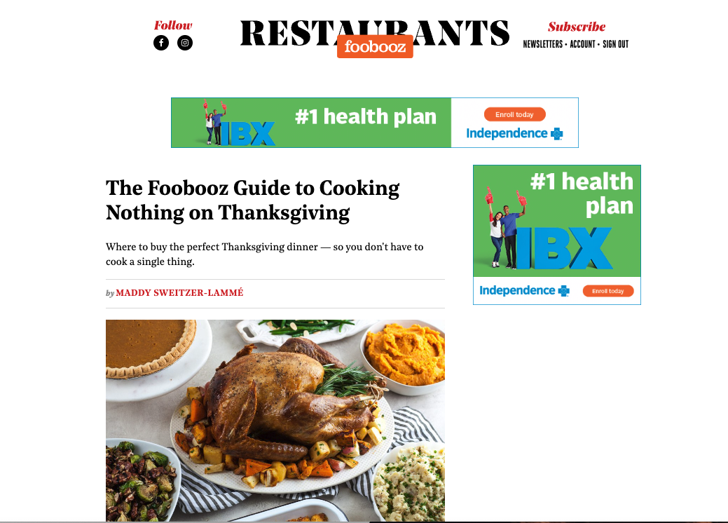 A Thanksgiving meal featuring a roasted turkey surrounded by bowls of stuffing, sweet potato mash, and other side dishes.