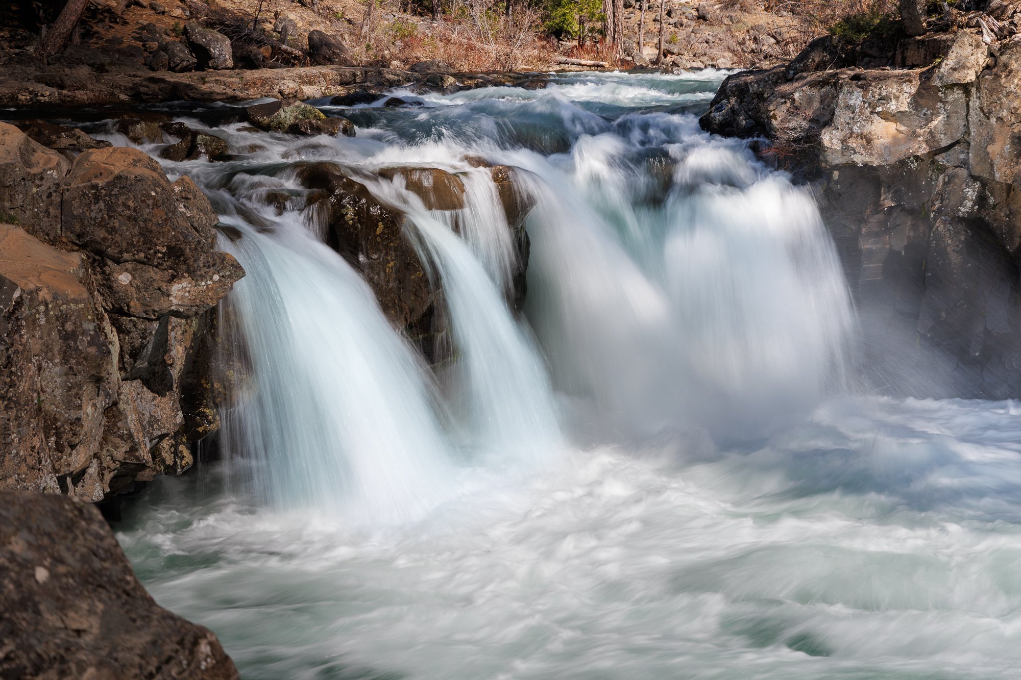 Lower McCloud Falls put on quite a show!

Chasing waterfalls in Northern California during my Waterfalls &amp; More Workshop leads us to this gem near Mt. Shasta. The snowmelt turned the falls into a roaring beauty during April, and the misty spray w