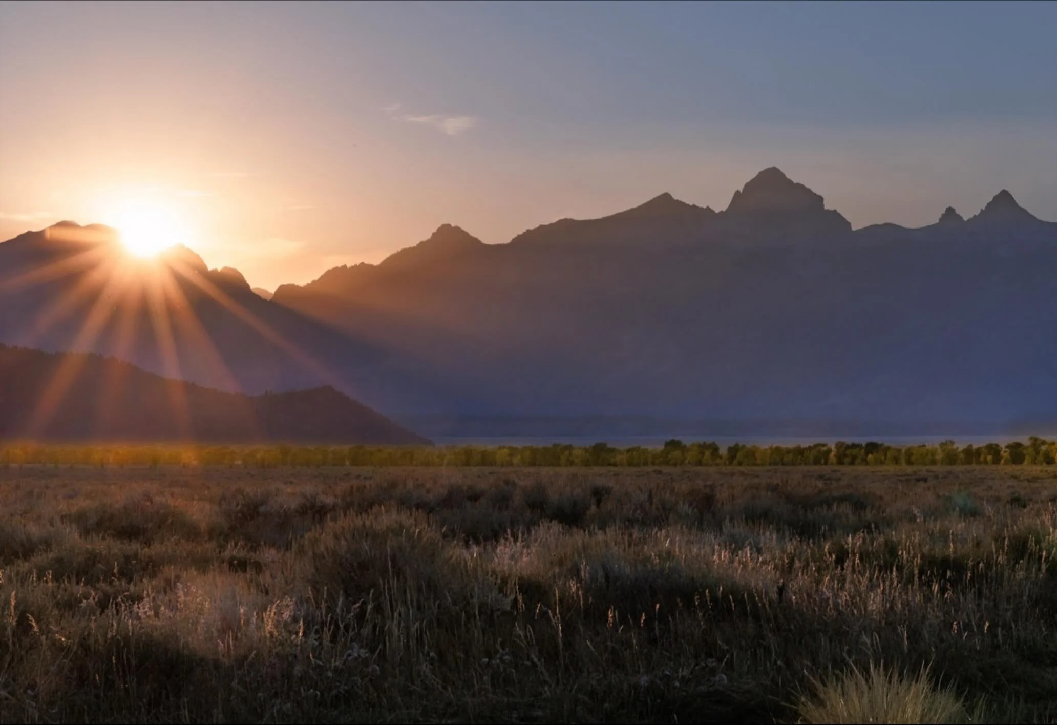 When that little bit of dust is in the air, sunset takes on a whole new beauty.  Chasing light with some of the @norcalwomenphotographers in Grand Teton NP.