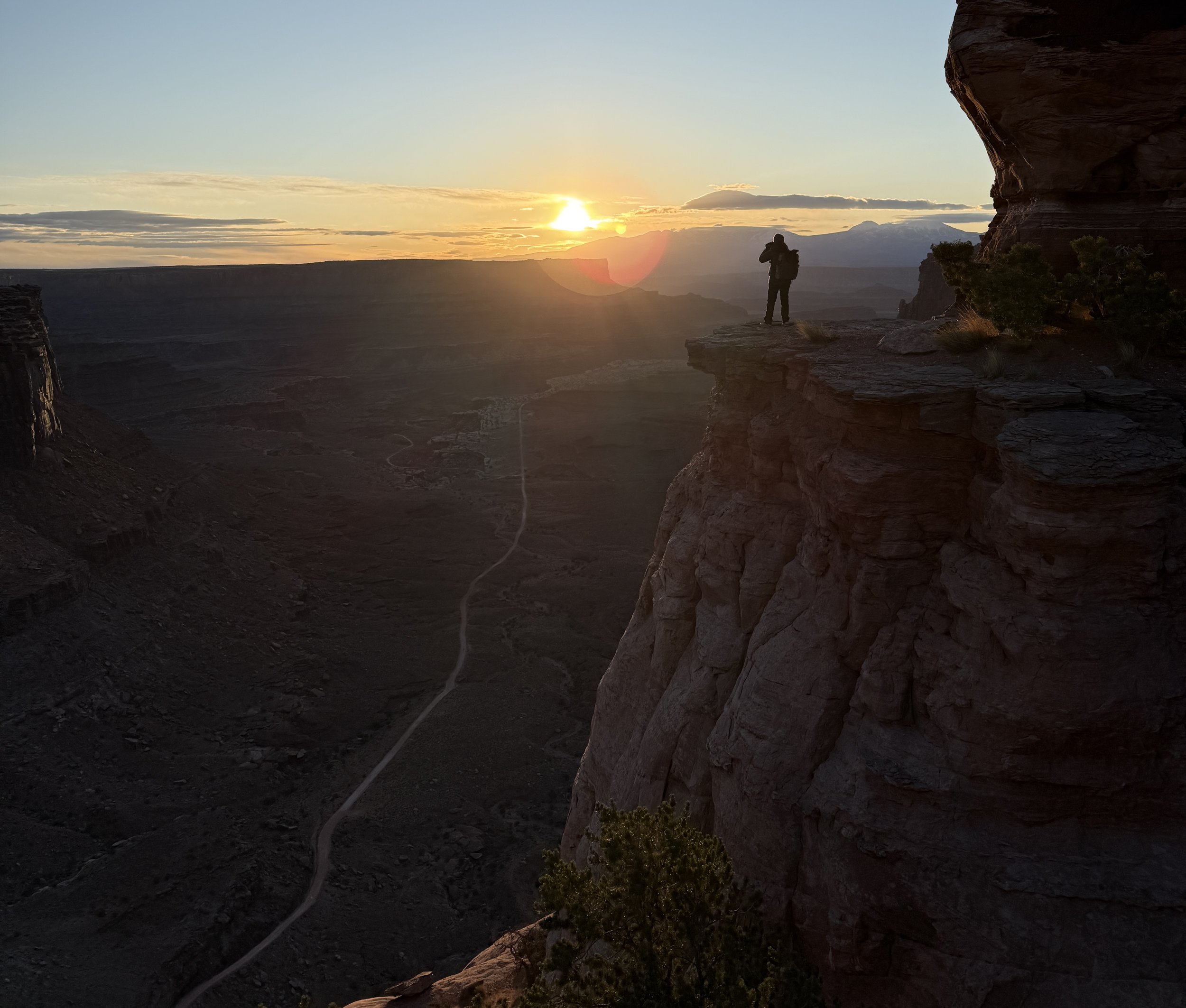 person standing on the cliff edge at Shafer Point, Canyonlands NP