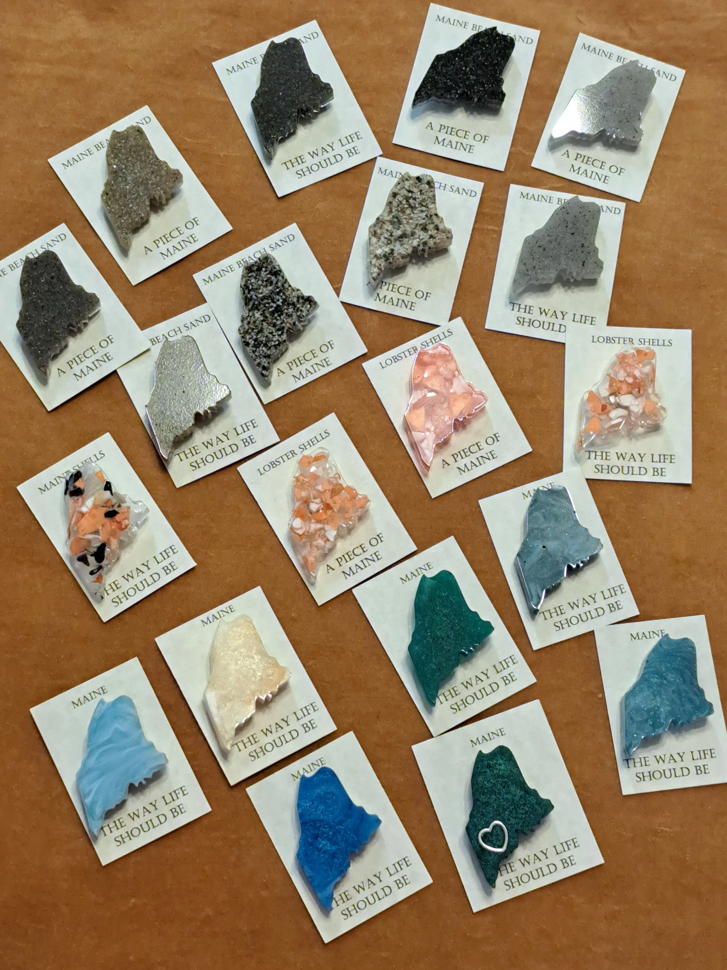 2 inch Maine magnets. Variety of colored, sand or shells