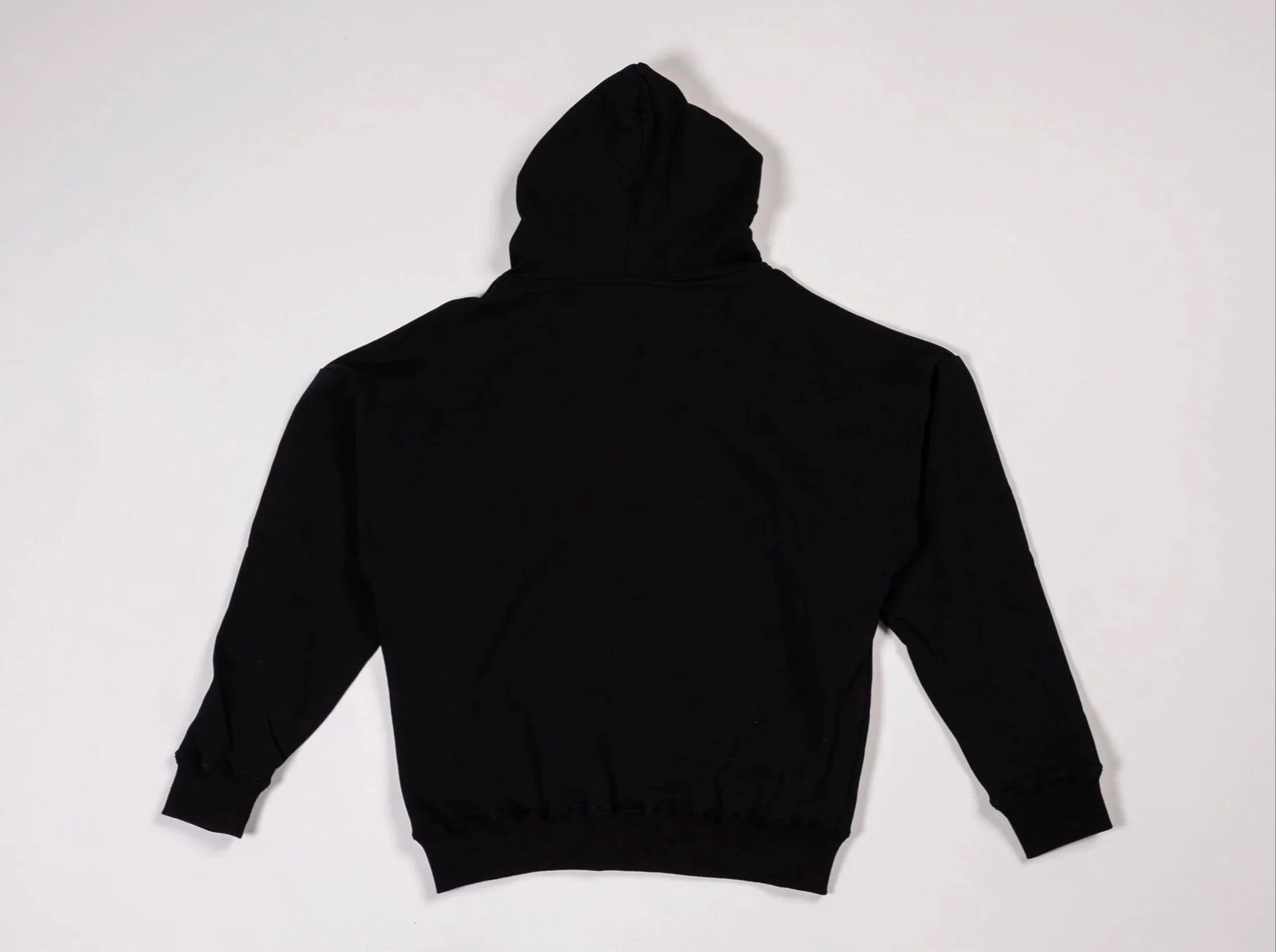 Back of black pullover hoodie with red graphic of woman’s face and silver metal-style ‘Mirrors’ abstract lettering across chest