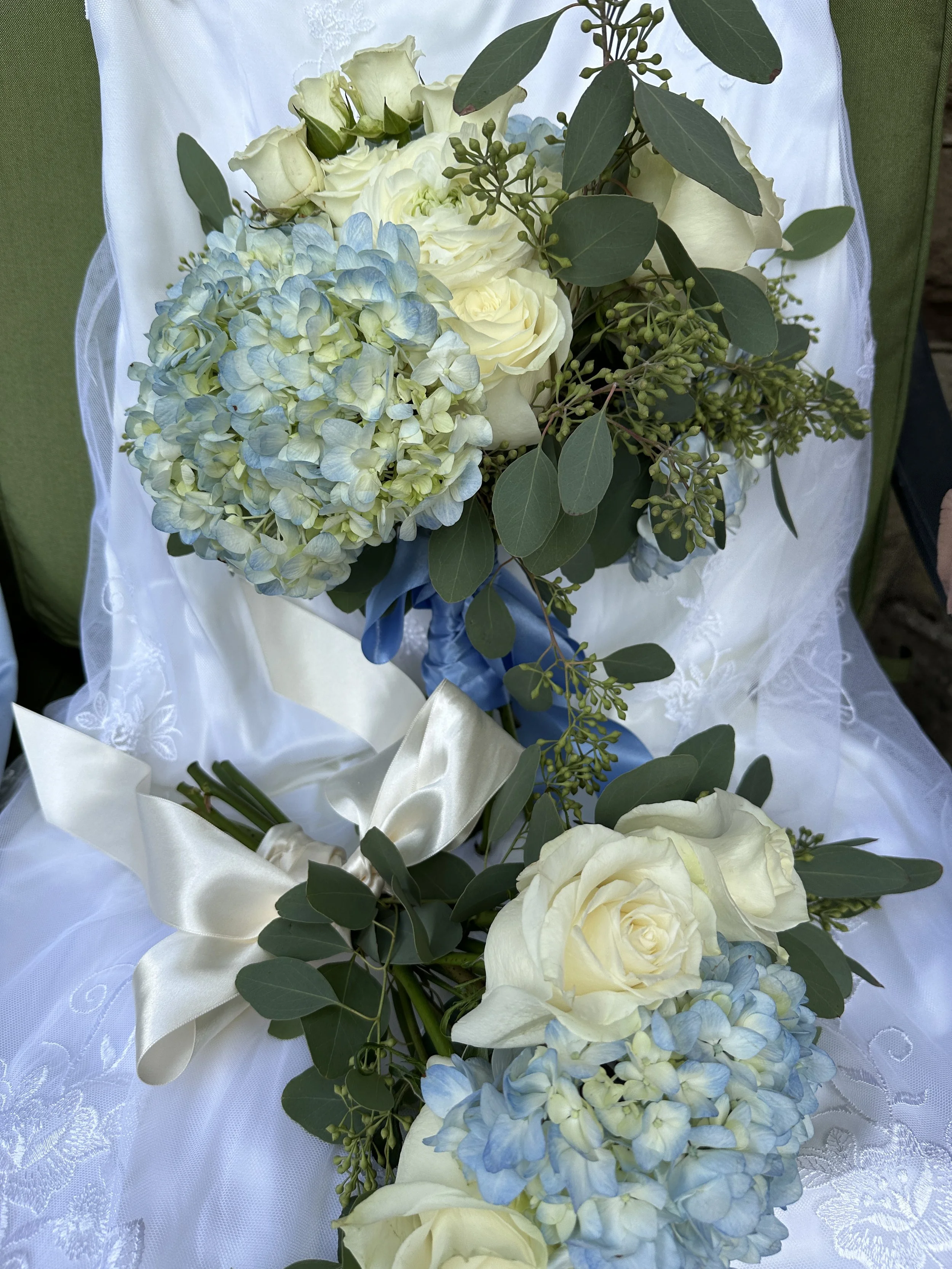 Bride's Bouquet in back Bridesmaid laying sideways