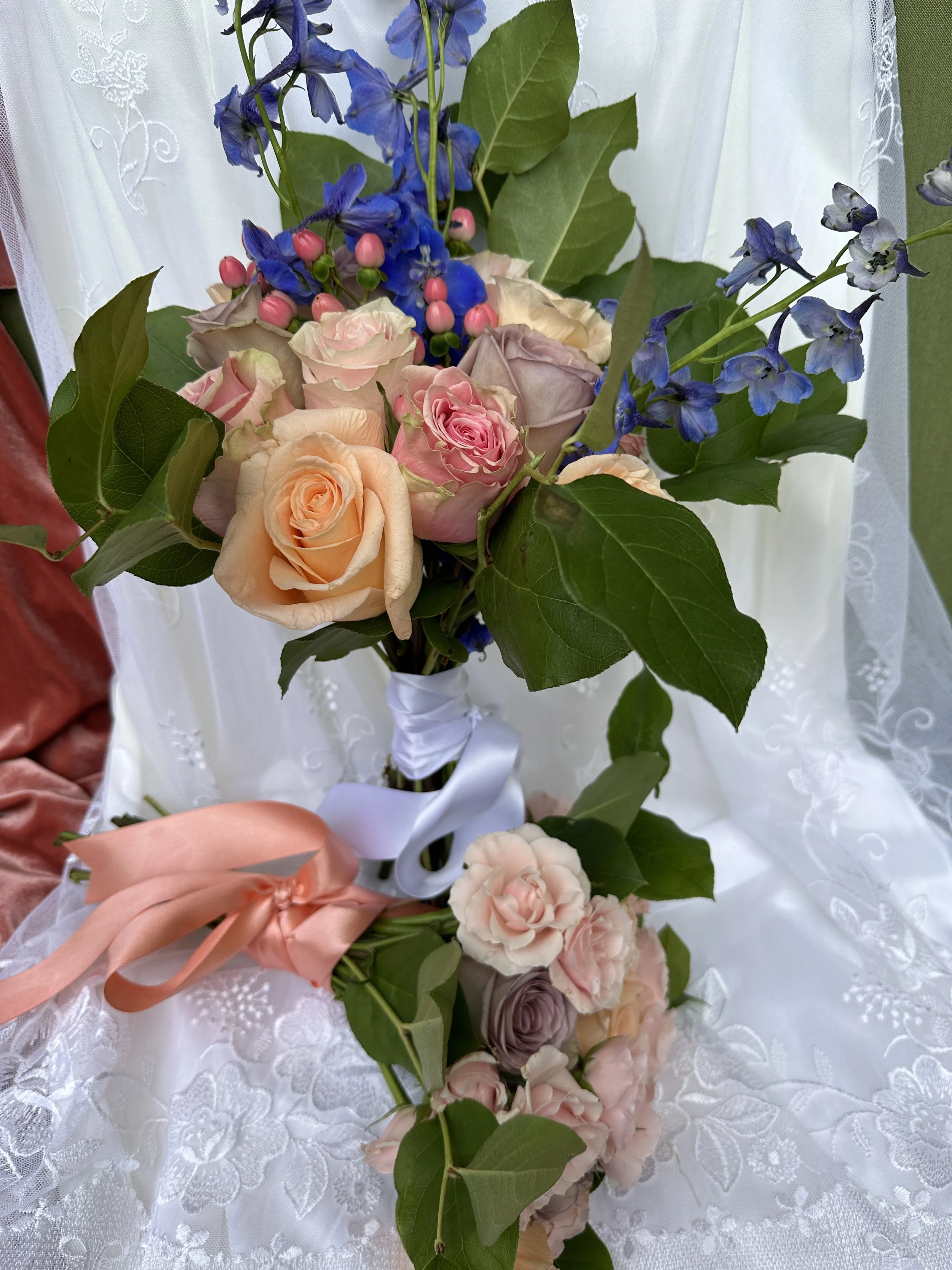 Brides Bouquet in the back Bridesmaid's in the front