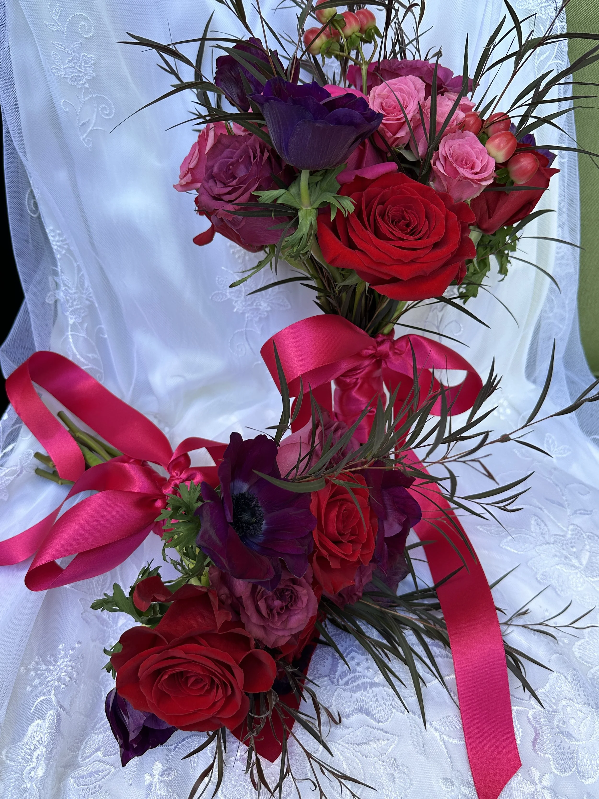 Bridesmaid bouquet in front of Bride's Bouquet
