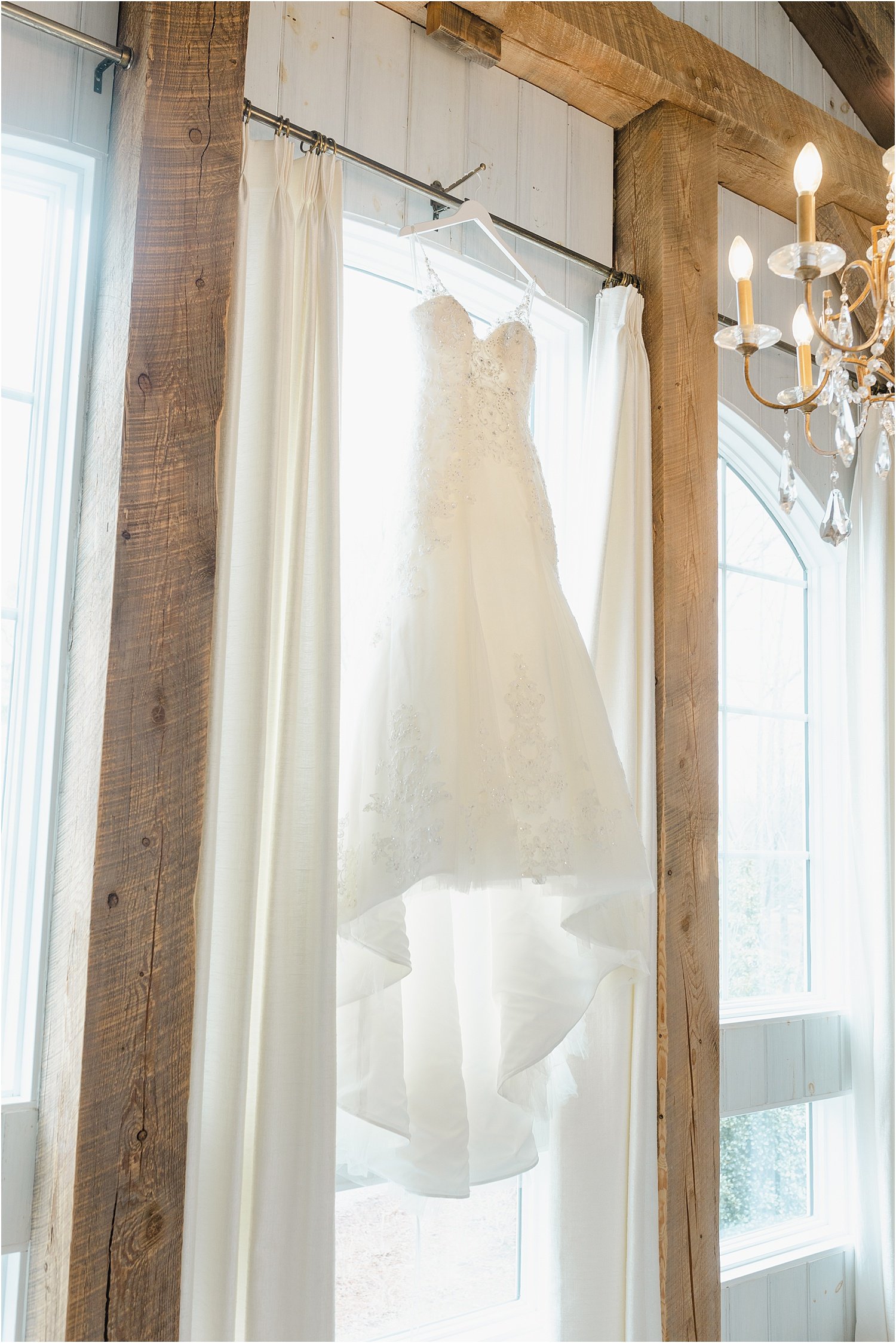 Beautiful Wedding Dress Hanging from Window