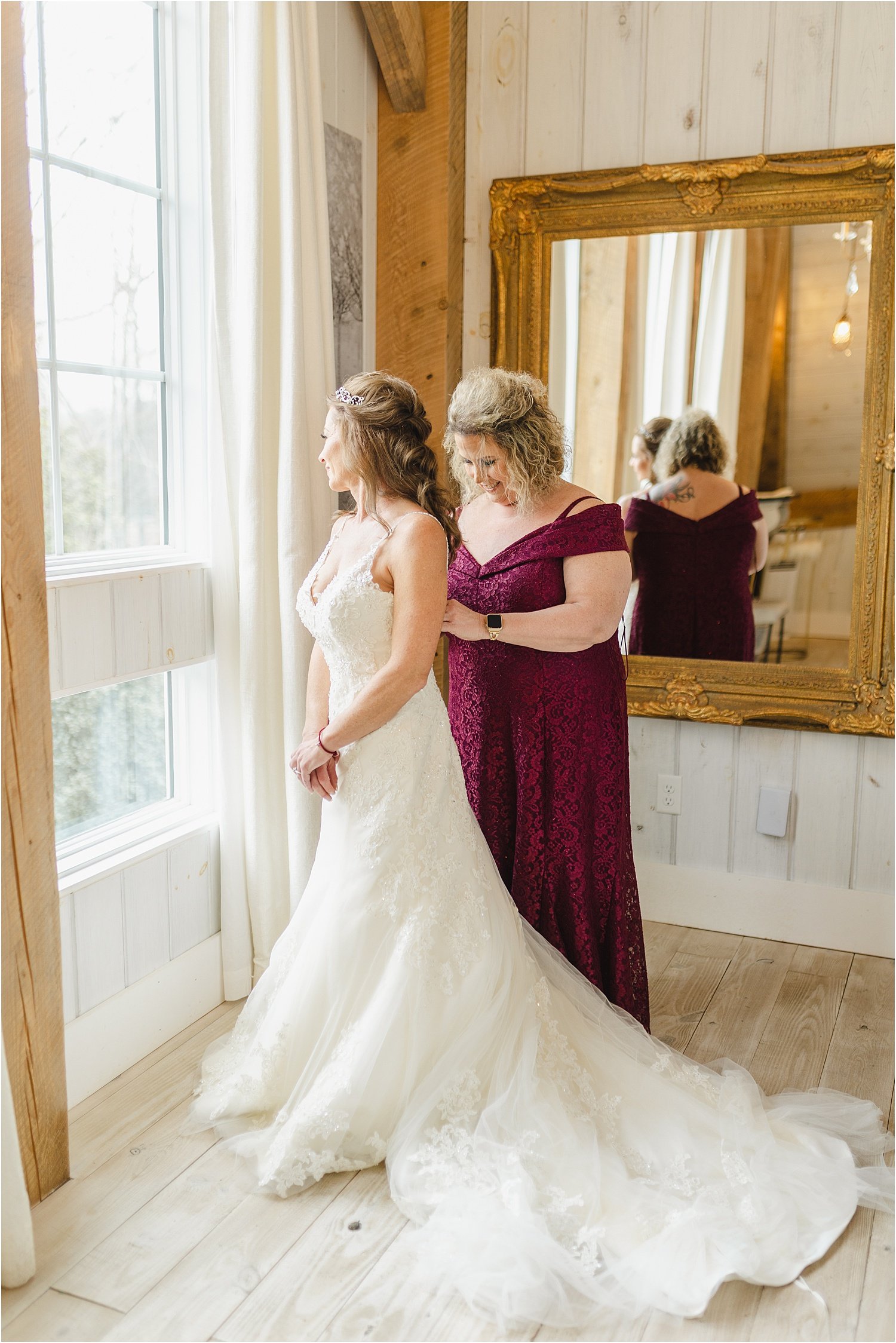 Maid of Honor Helping Bride Get Into Wedding Dress