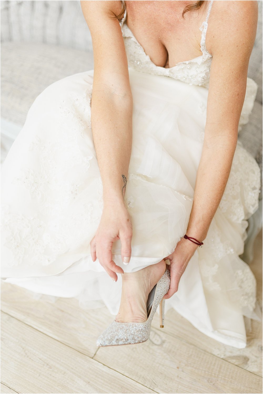 Bride Putting on Her Shoes