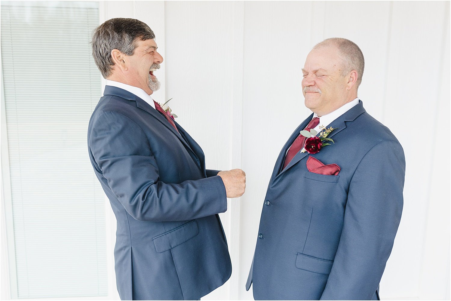 Photo of Groom and Best Man Laughing