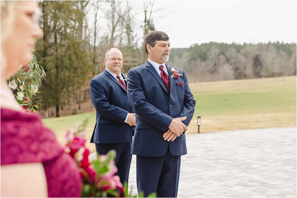 Groom Watching His Bride Walk Down the Aisle