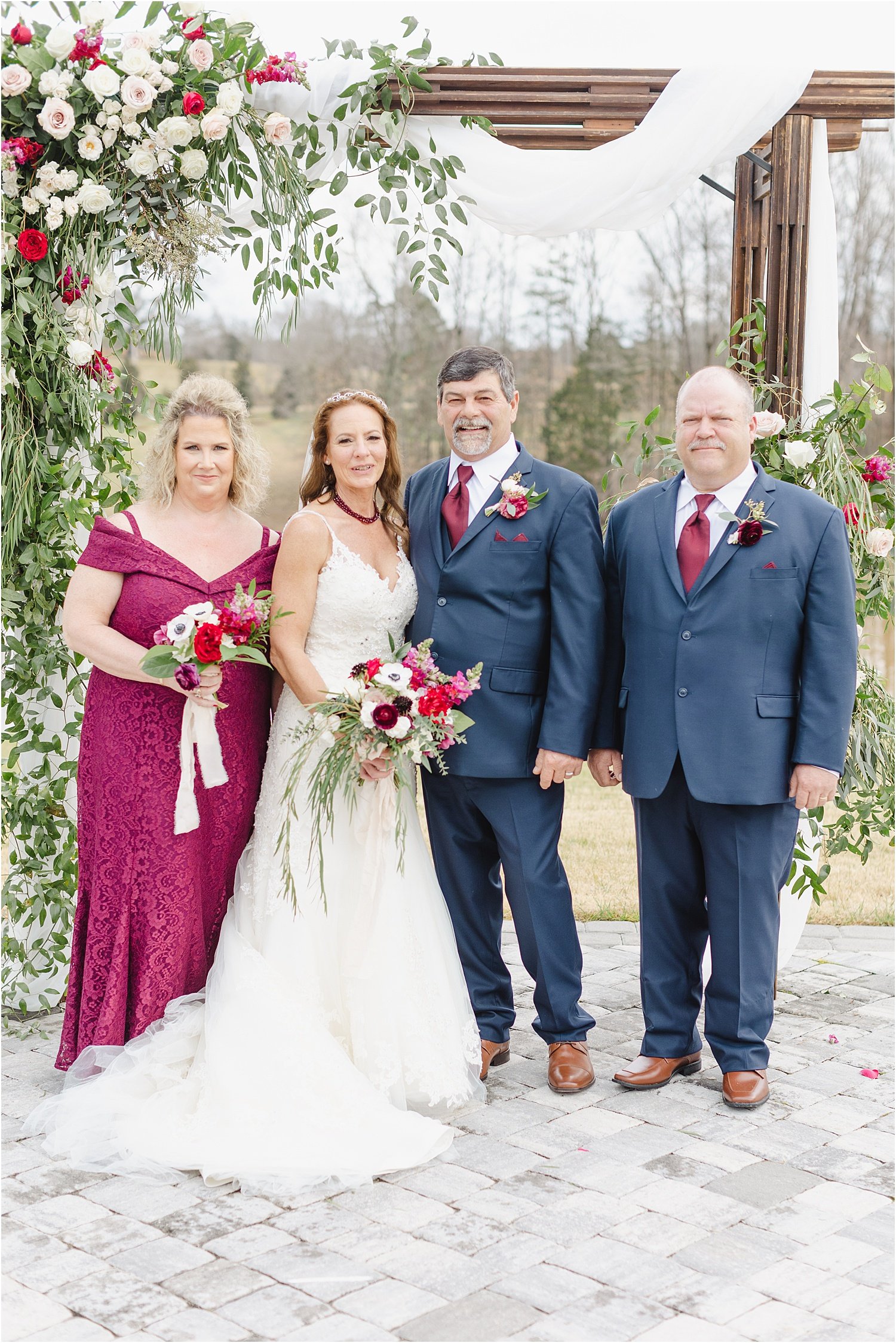 Photo of Bride and Groom with Their Maid of Honor and Best Man